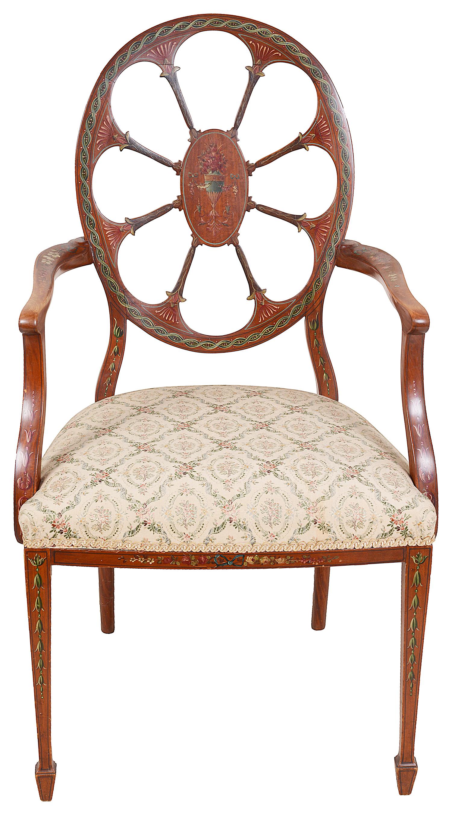 A very good quality late 19th century satinwood, Sheraton revival armchair, having wonderful hand painted classical motif, flower and urn decoration, the back rest with a central oval panel by carved palm like supports. A stuff over upholstered