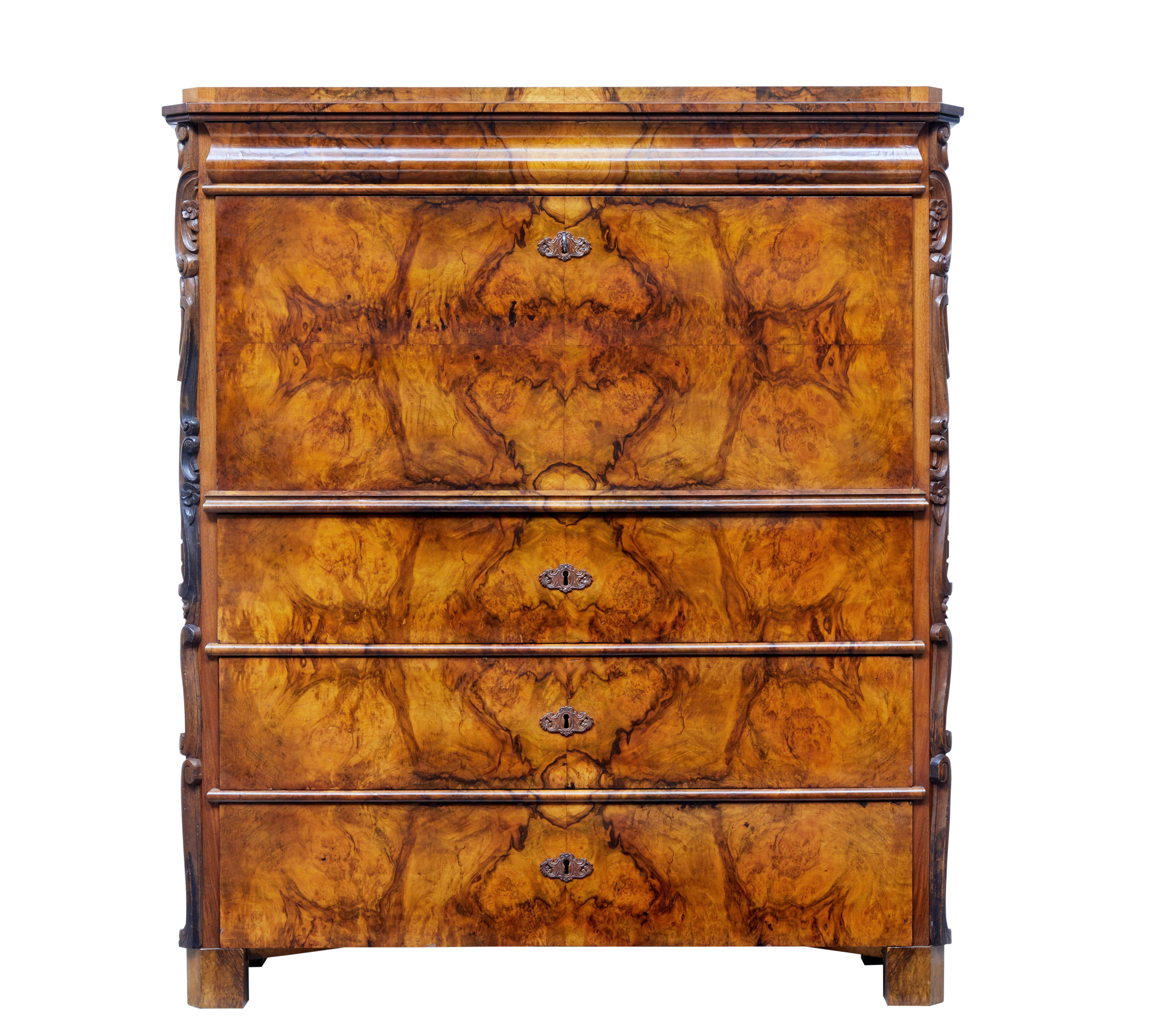 Fine quality Scandinavian burr walnut escritoire, circa 1870.

Stunning example made with matching burr walnut veneers to the drawer and fall fronts. Burr top surface and canted corners with applied swag carvings. Concealed drawer below the top