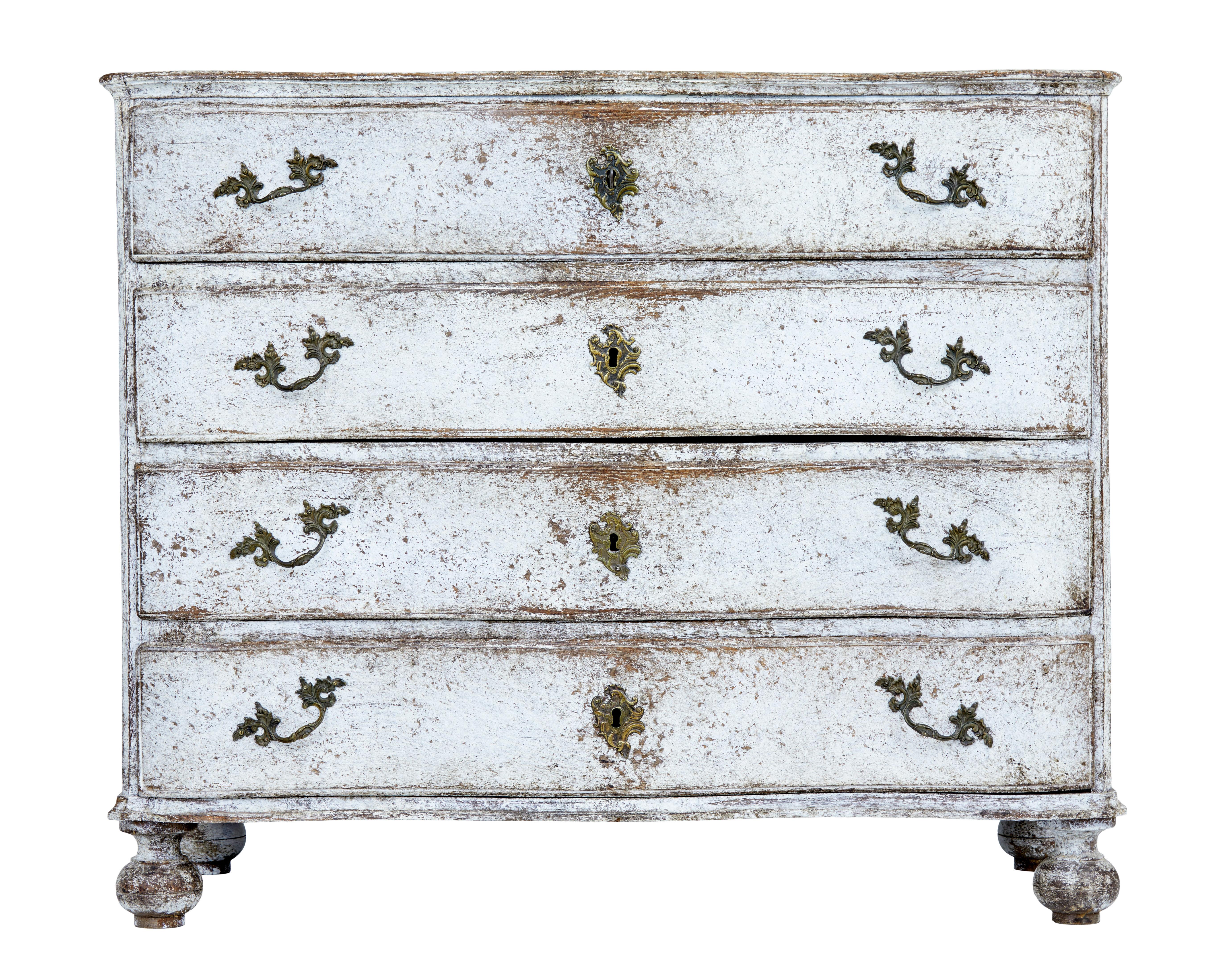 Fine quality solid oak chest of drawers, circa 1840.

Possibly Danish with later paint which has now taken on its current appearance.

4 drawers with shaped fronts, each with later decorative handles. Original handles to the sides.

Standing