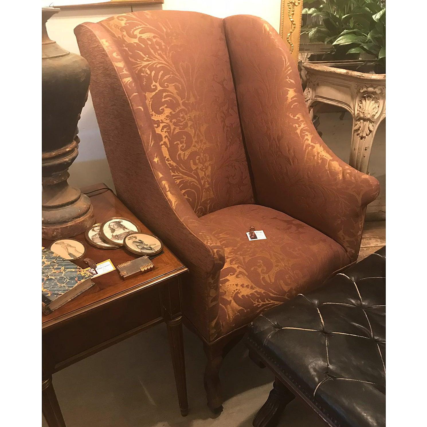 This wingback chair is upholstered with antique silk upholstery fabric from Paris. 
I purchased it in Provence. 
I remember finding this very old woman who showed me some short yardages of amazing silks that were out of the back of her van. She