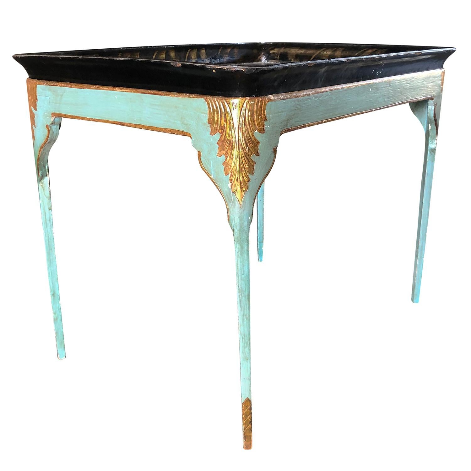 An antique Swedish Gustavian tray table in old paint and gilded colored Acanthus leaves on all sides with removable tray. The black-turquoise Scandinavian side table is made of hand crafted painted Pinewood, in good condition. Minor fading,