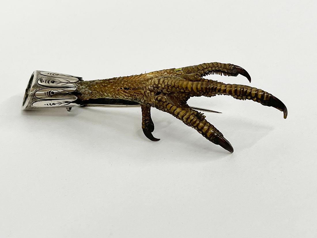 19th Century Scottish capercaillie foot brooch

A Scottish capercaillie foot, also known as the leg of a grouse set as a brooch or kilt pin mounted on silver (not hallmarked)
The back may have had a monogram or family crest. For the enthusiast, an