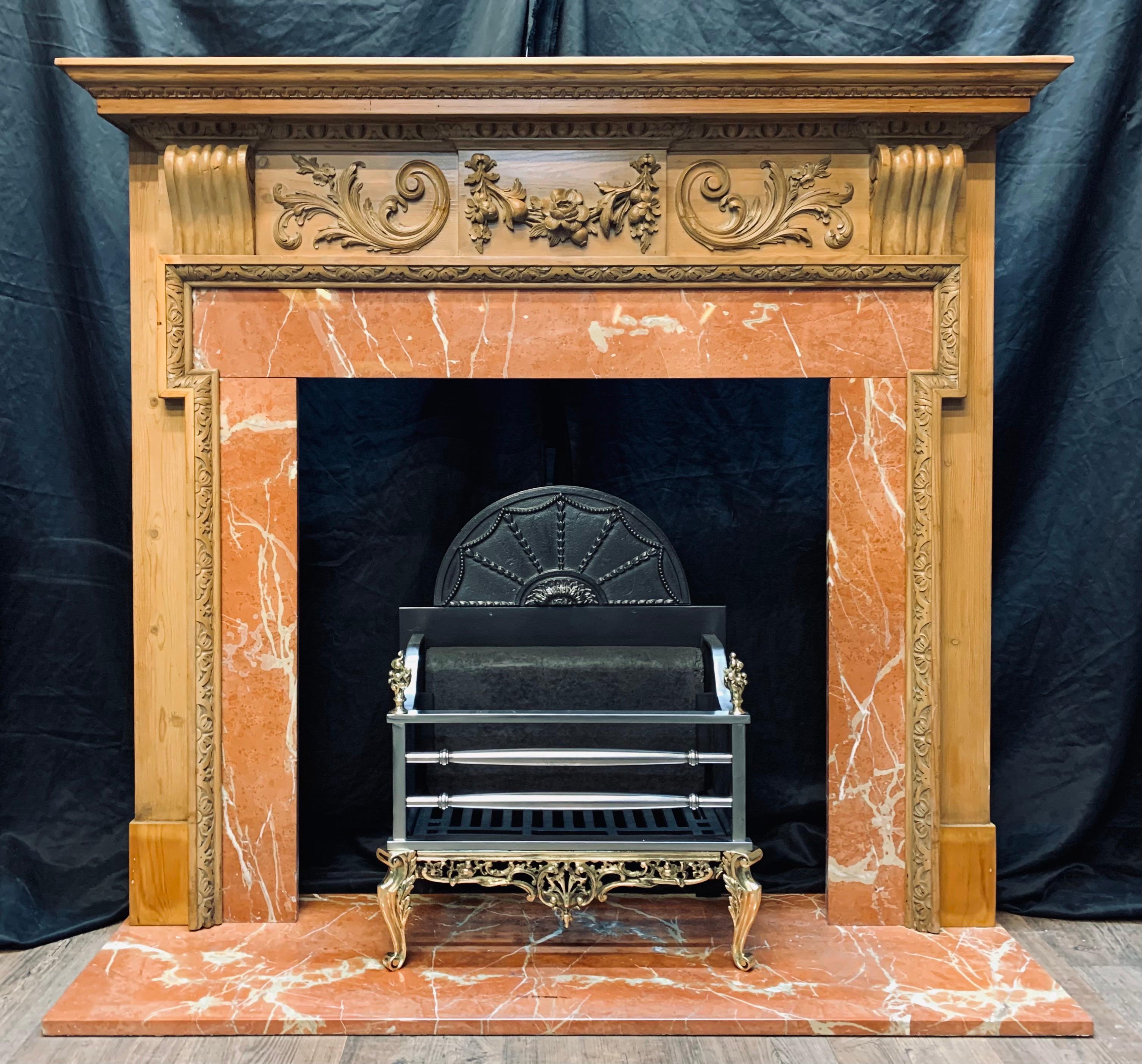 A very attractive original 19th century Scottish carved pine fireplace surround. A corniced double top shelf sits above a through frieze, the egg and dart frieze cornice hosting a central tablet displaying a well carved flowering swag, flanked by