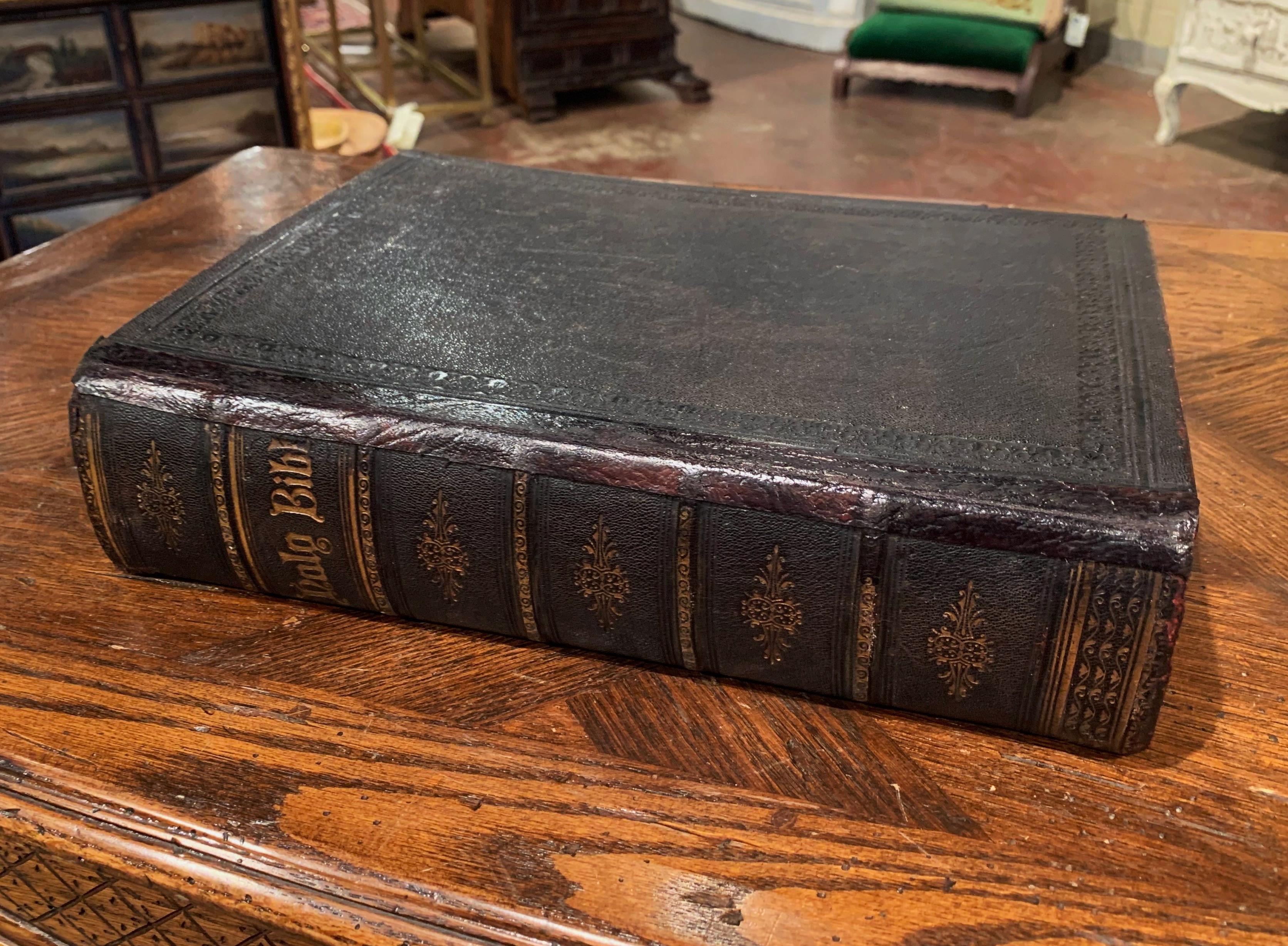 This beautiful antique practical and devotional Bible, was printed in Glasgow, Scotland by Williams Collins and Co., circa 1860. The religious book flaunts a black leather cover, embellished with tooling and top page edge gilt. Inside, the Bible