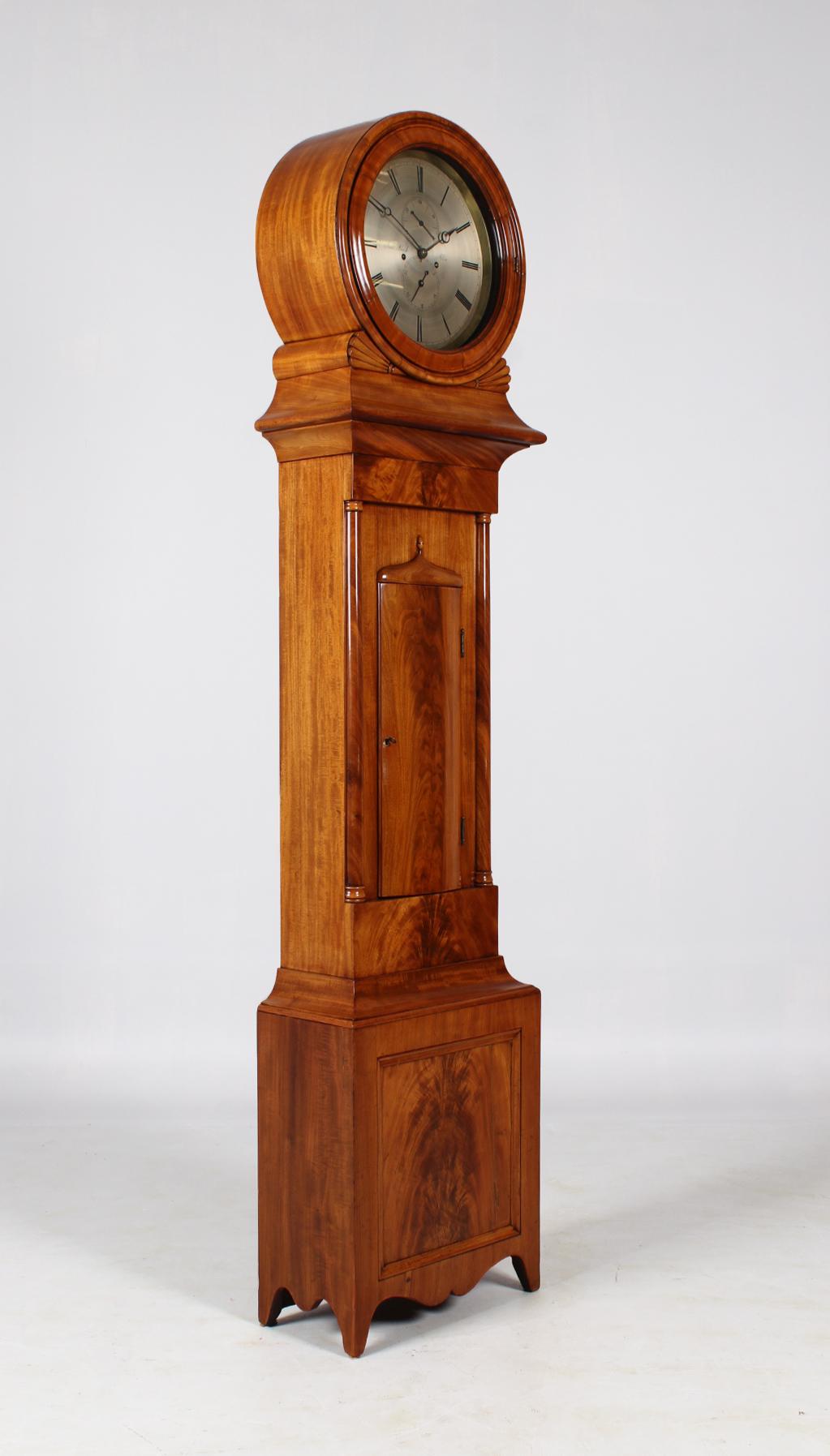 Antique grandfather clock

Scotland
Mahogany
Victorian around 1835

Dimensions: H x W x D: 208 cm x 46 x 24 cm

Description:
Slender clock case standing on graceful cut-out feet.
Bleached plain mahogany wood with beautiful grain.
To the