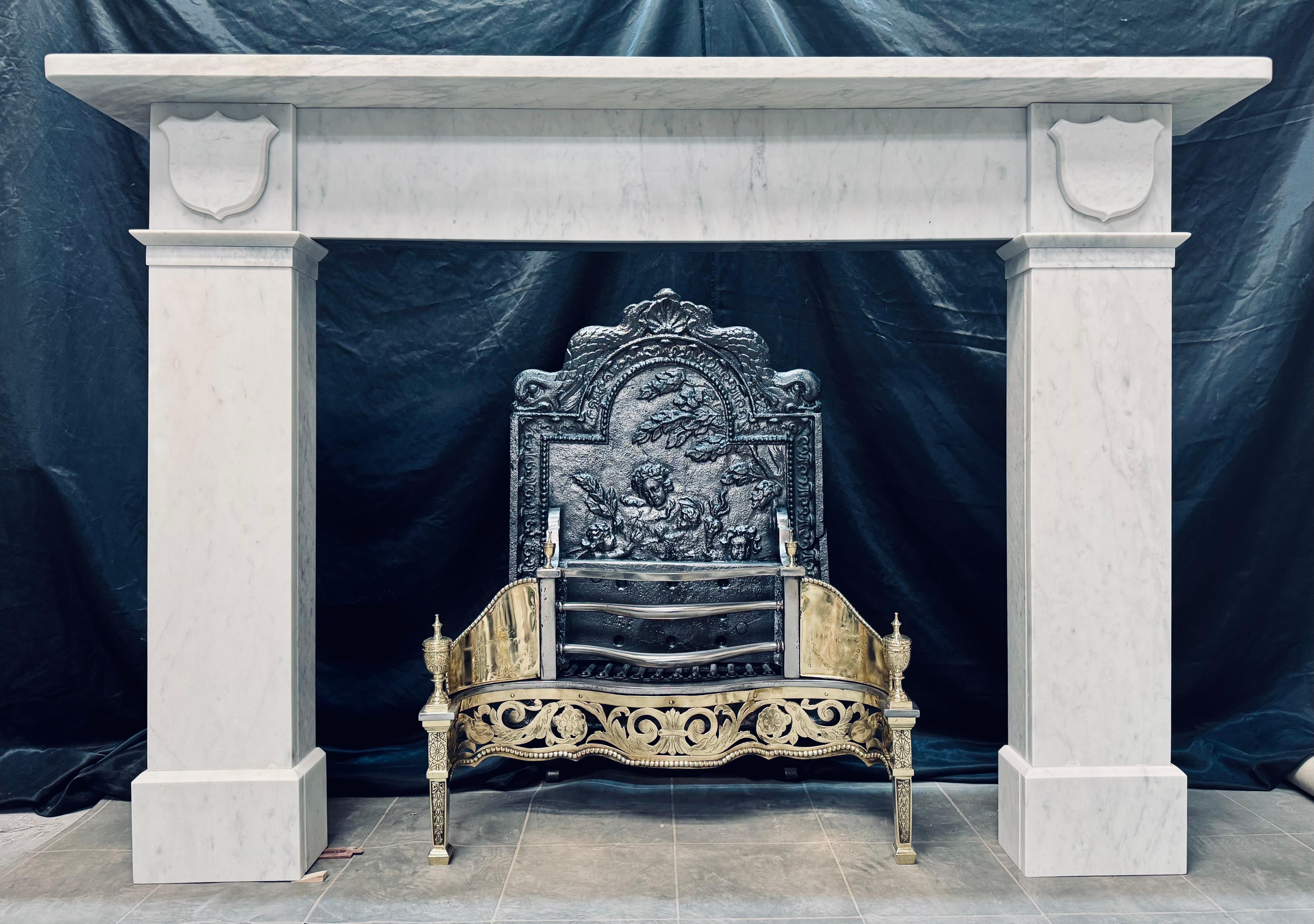 A well proportioned Scottish 19th Century mid Victorian lightly veined marble fireplace surround. 
A generous top shelf sits directly above an unadorned frieze, flanked by wide jambs with splayed and block separations at frieze level. 

Generous