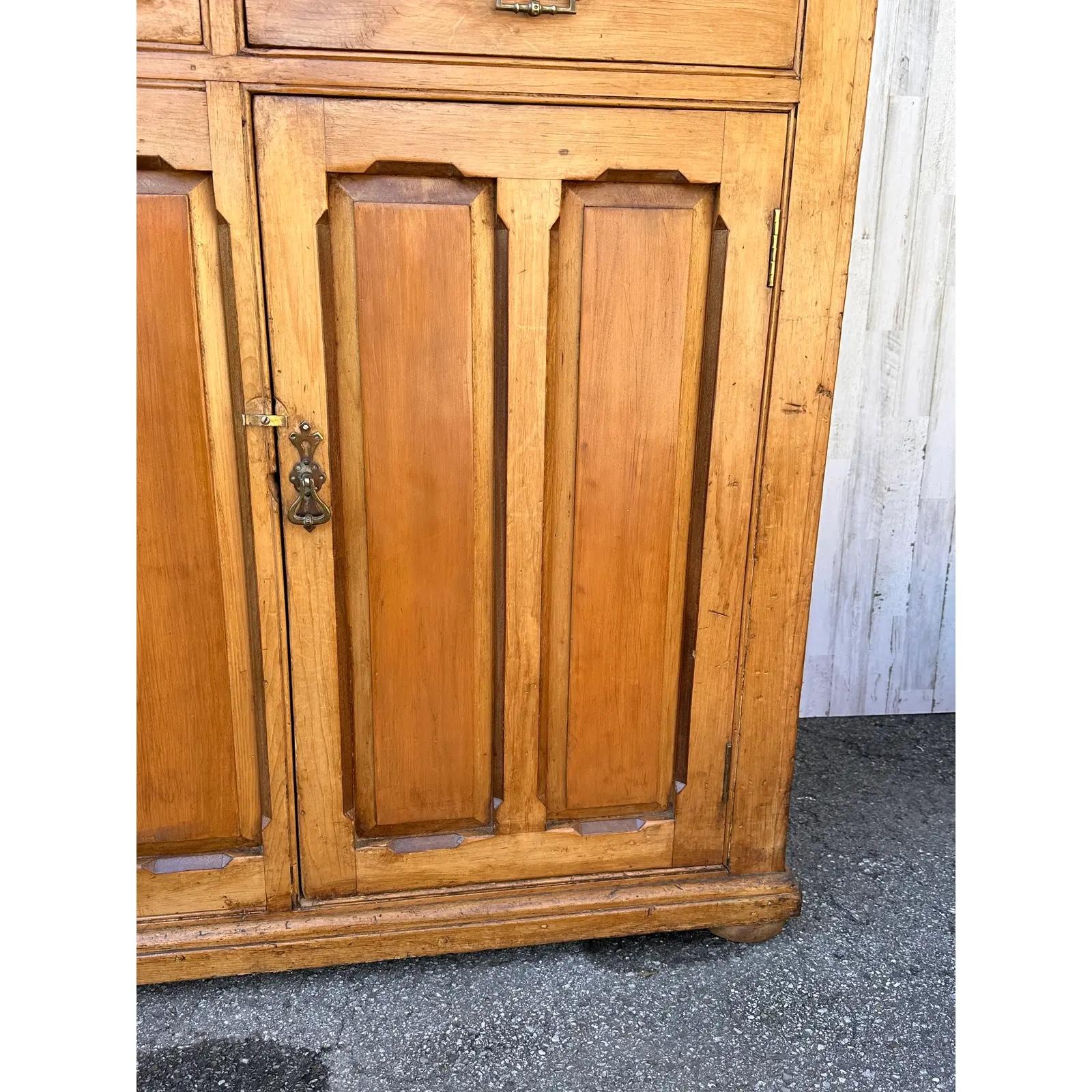 This is a fantastic early 19th century Scottish pine cupboard all original condition two doors on the bottom opening into ample storage three drawers on the top with a small accent drawer in the center. With such amazing patina and incredible design