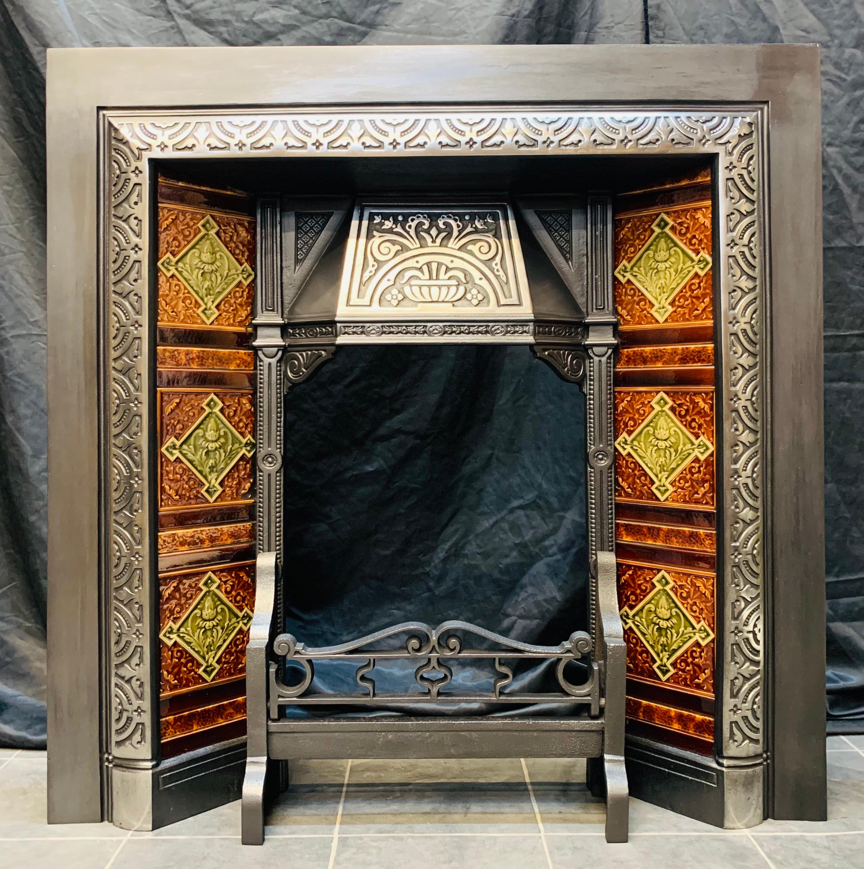 An attractive 19th century Scottish cast Iron fireplace insert with attractive thistle design tiles to the side sections, the canopy hood has been highlighted along with the raised border giving this piece a sense of vibrancy. 

Glasgow, Scotland