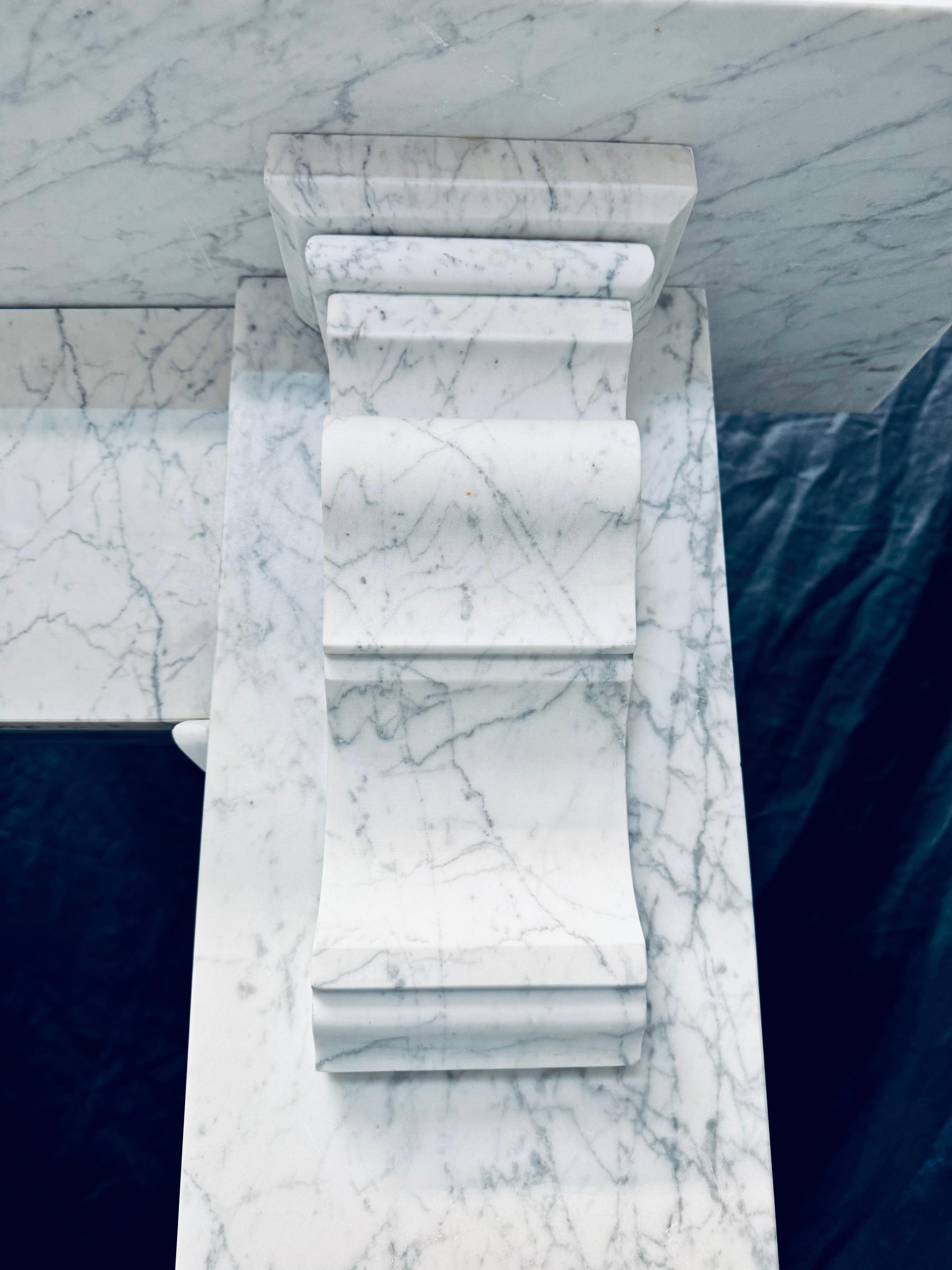 Carved 19th Century Scottish Victorian Carrara Marble Corbeled Fireplace. For Sale