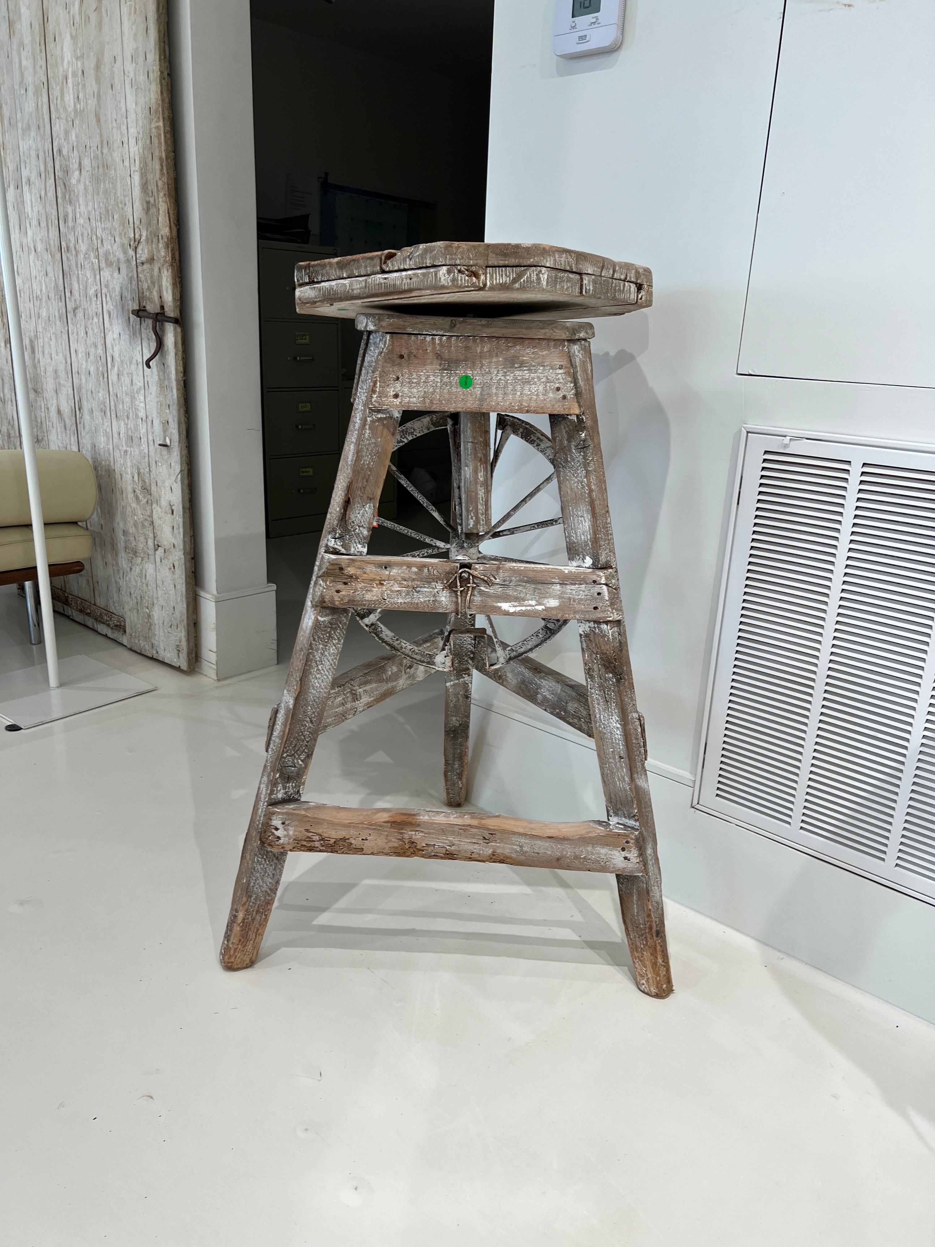 An authentic wooden stand for creating sculptures.  Splattered with paint and plaster, the stand looks like it came straight out of a working studio in Paris.