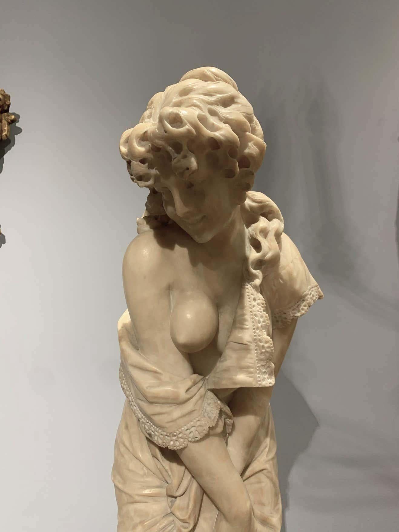 La Sorpresa 
by Cesare Lapini (Italian, (1848 - 1910)
Alabaster
H 35 in. (88.9 cm)

Cesare Lapini  was a sculptor of allegorical and genre subjects modeled after Antiquity. He contributed six sculptures to the Esposione Generale Italiana di Torino