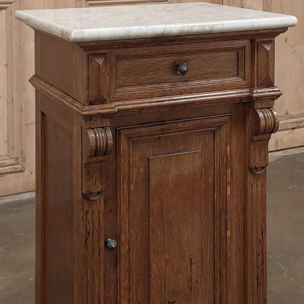 19th Century Second Empire Pine marble top nightstand is a wonderful example of the style, expressed by craftsmen from the outlying regions. A tailored neoclassical architecture dominates the design, with a brace of fluted corbels and pyramidal
