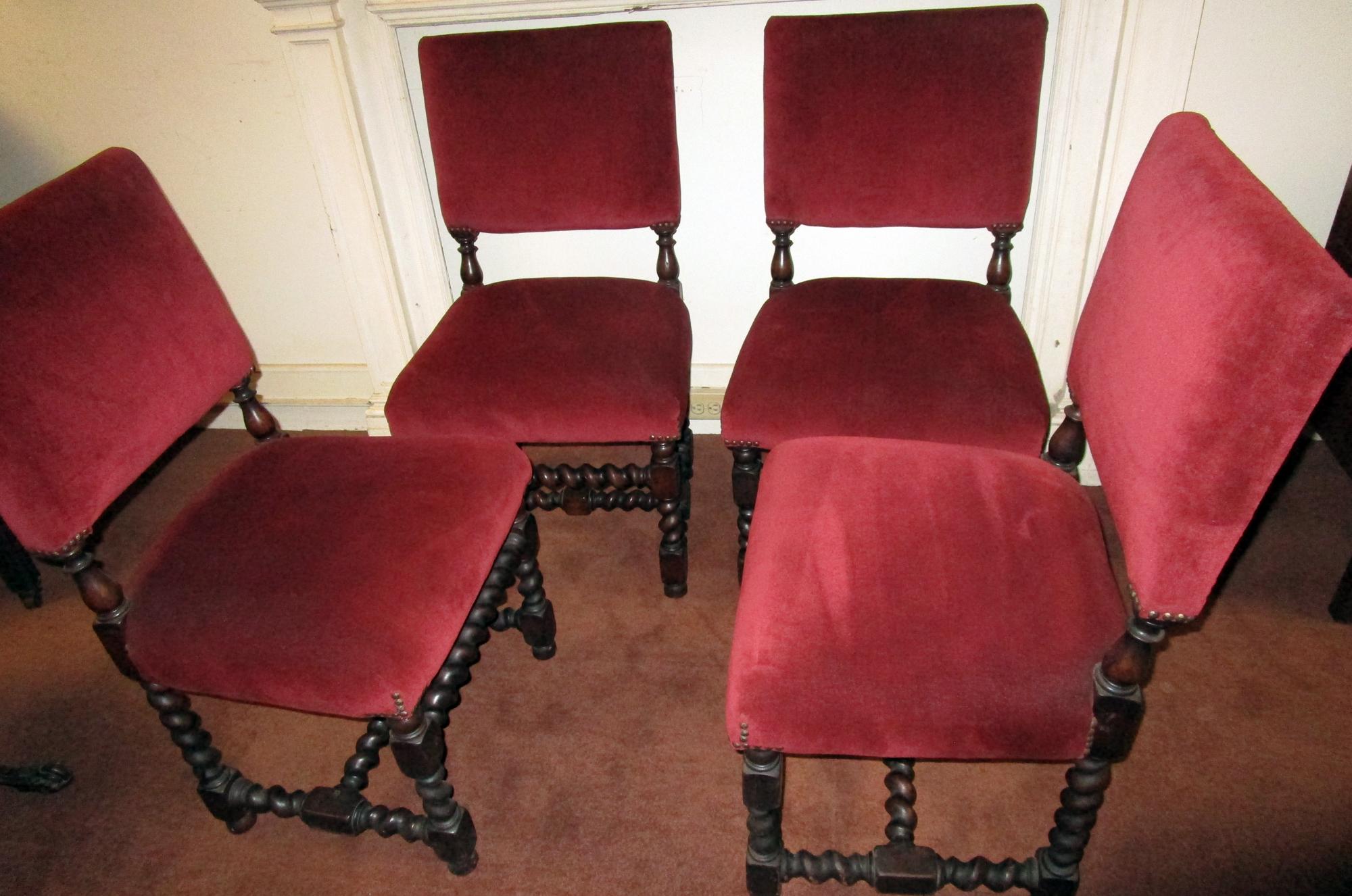 Set of four solid oak barley twist English chairs newly upholstered in claret colored fabric with brass nailhead trim. These are not reproductions, they are mid-19th century Jacobean revival and are very substantial. See measurements below.