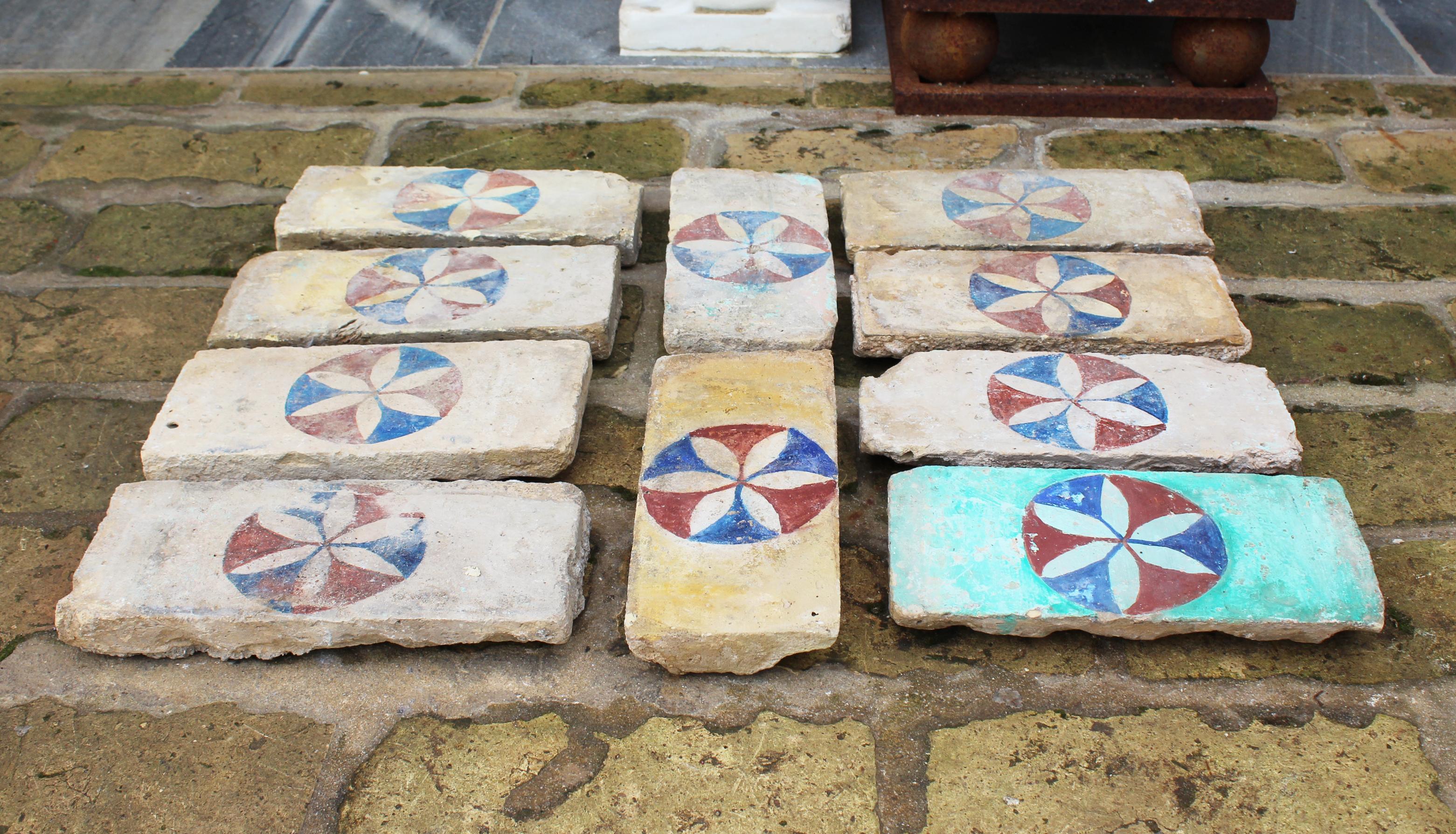 19th century set of 10 Andalusian hand painted bricks with flower motif. 

Dimensions correspond to one brick.