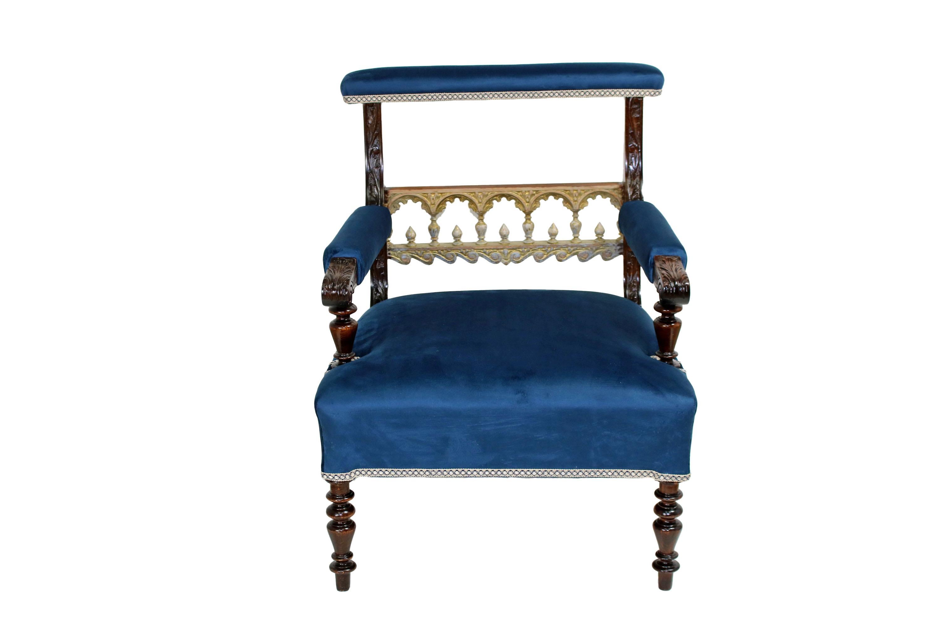 A beautiful set of two armchairs in a stunning blue. It may be of interest that this set was manufactured as a custom order and the customer had made a funny variation in one of the chairs - one decorative column in the balustrade at the back of the