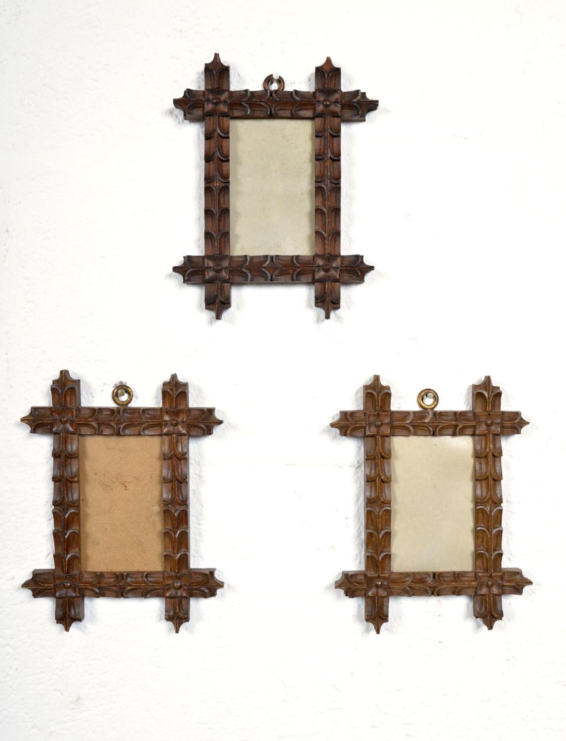 A beautifully carved set of three Bavarian picture frames elaborately carved using the ‘notch cut’ technique, each of the wooden frames is held together with a cross-lap joint. Dating from the mid 19th Century, the set of three matching hand-carved