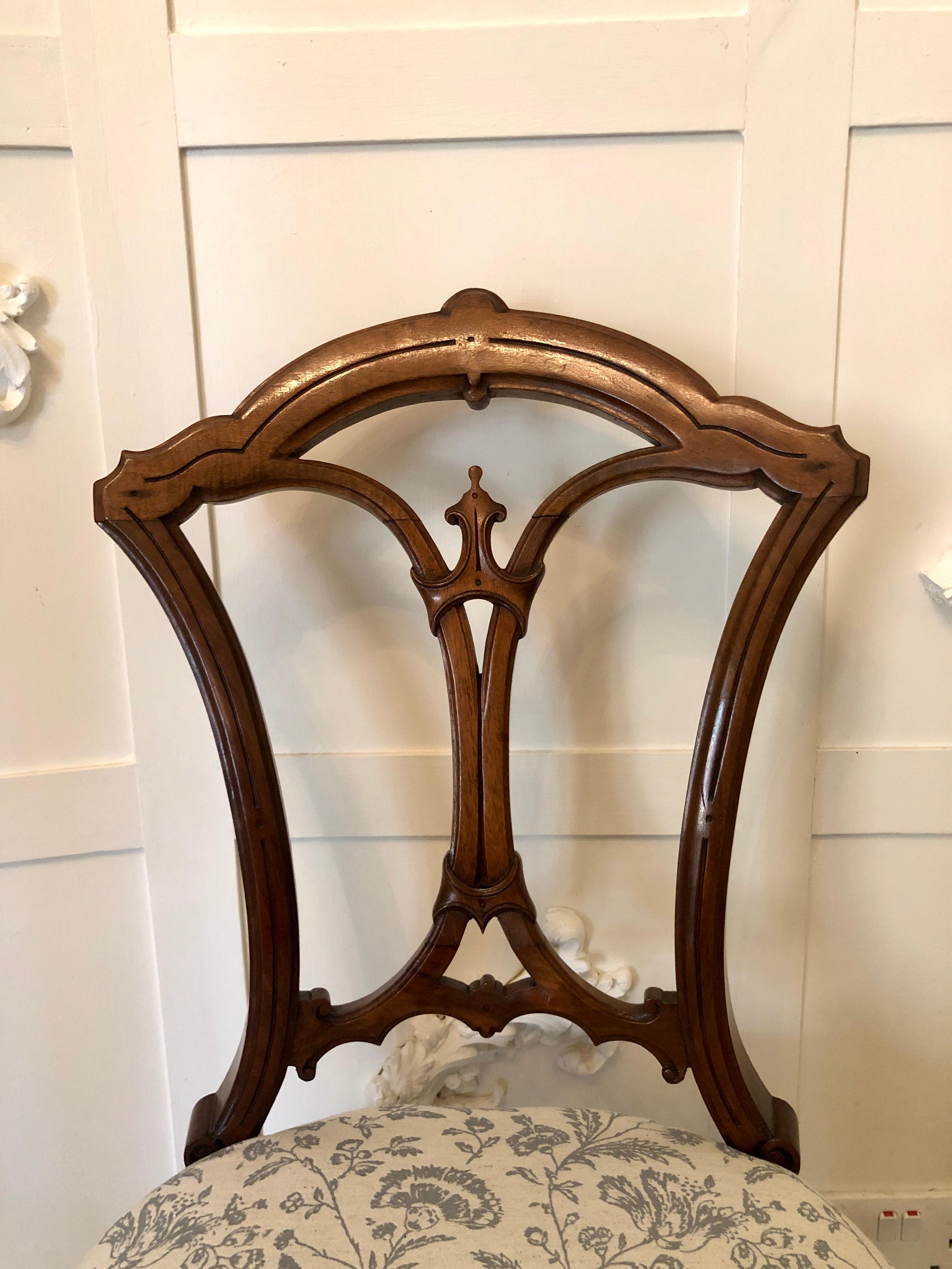 Quality set of 4 19th century antique Victorian walnut dining chairs having a superior shaped carved top rail and unusual shaped carved centre splat. Two elegantly shaped cabriole legs to the front and outswept back legs. Newly reupholstered