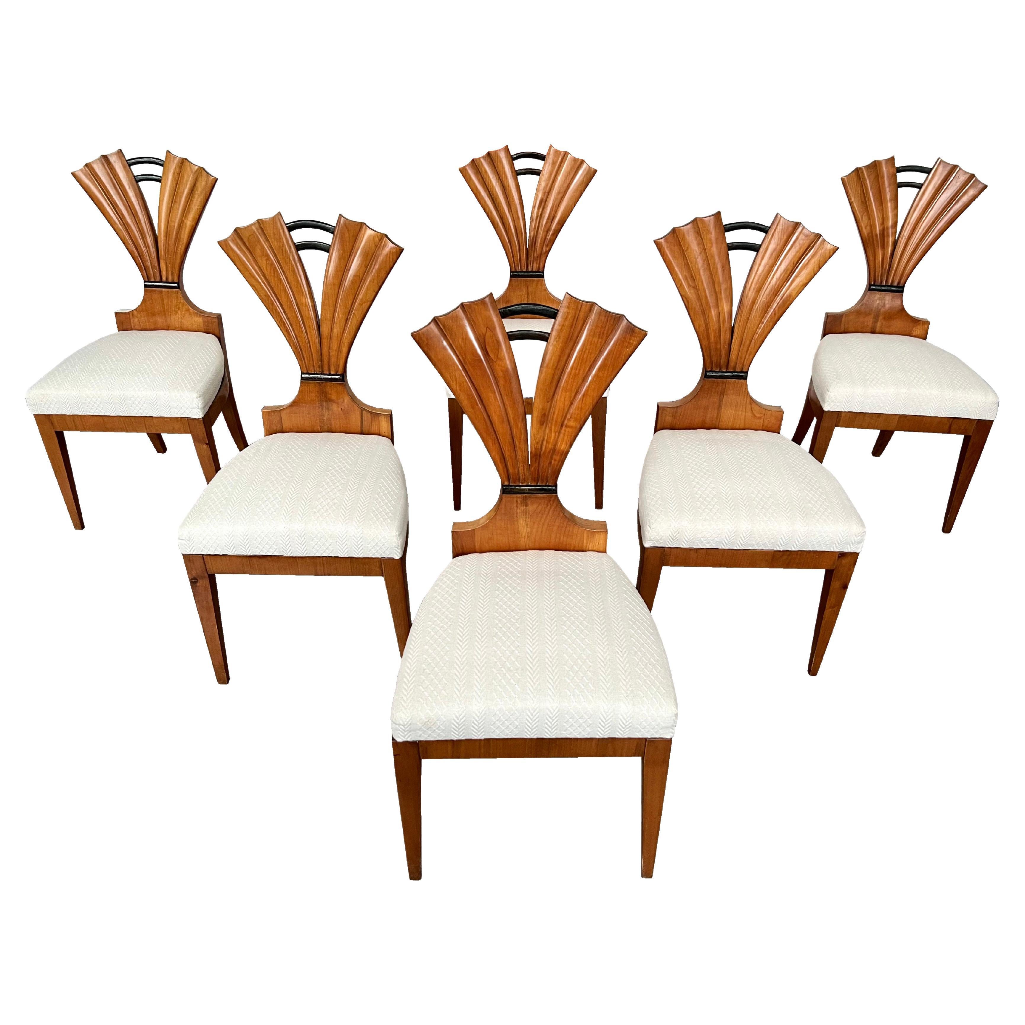 Hello,
These exceptional set of six Viennese Biedermeier cherry chairs from c, 1820-25 is attributed to Josef Danhauser who was the most prolific Viennese cabinet maker during the Biedermeier era. 
His pieces reflect innovative design and highest