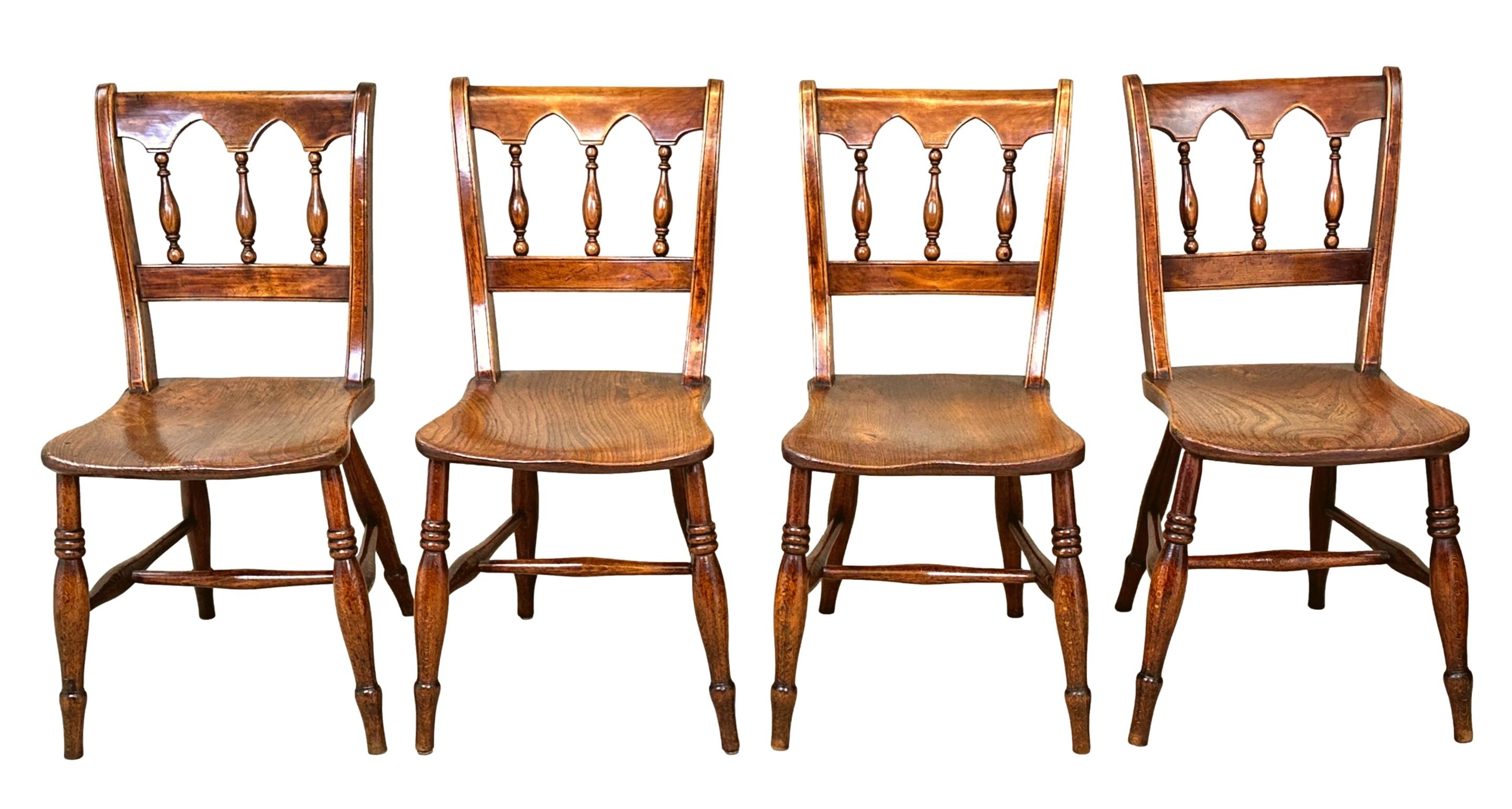An Extremely Attractive, Matched Set Of Eight, Mid 19th Century Elm And Beech Farmhouse Kitchen Windsor Dining Chairs, Having Elegant Arched Rails With Spindle Turned Upright Supports To Backs, Over Shaped Seats Raised On Turned Legs And