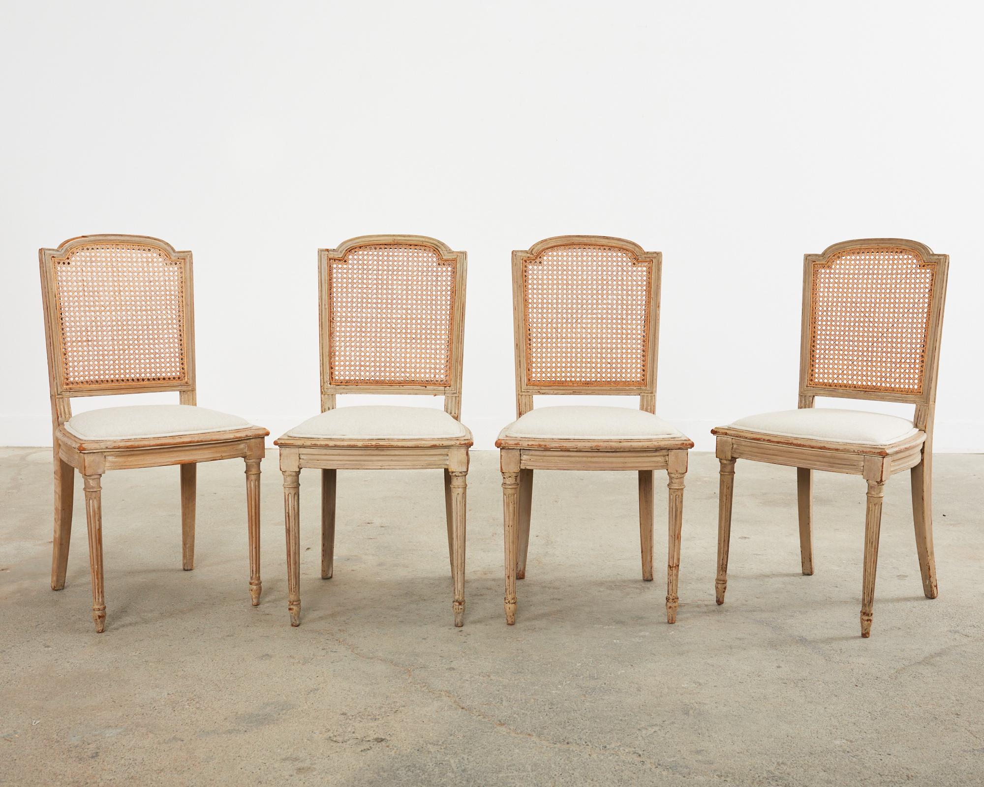 Painted 19th Century Set of Four Swedish Gustavian Caned Dining Chairs