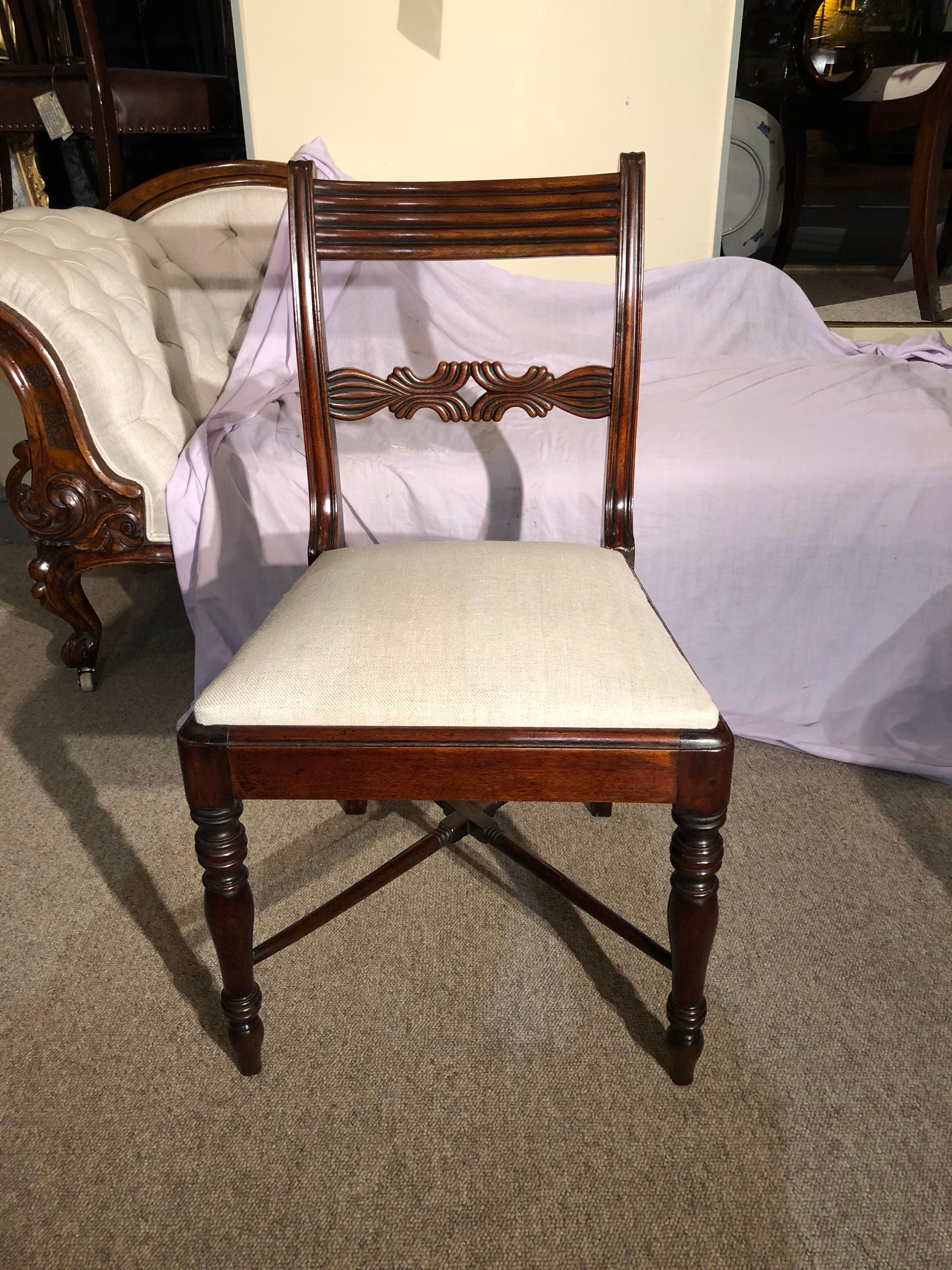 A fantastic quality set of six Regency mahogany dining chairs, of exceptional design. Recently reupholstered in a neutral linen fabric.