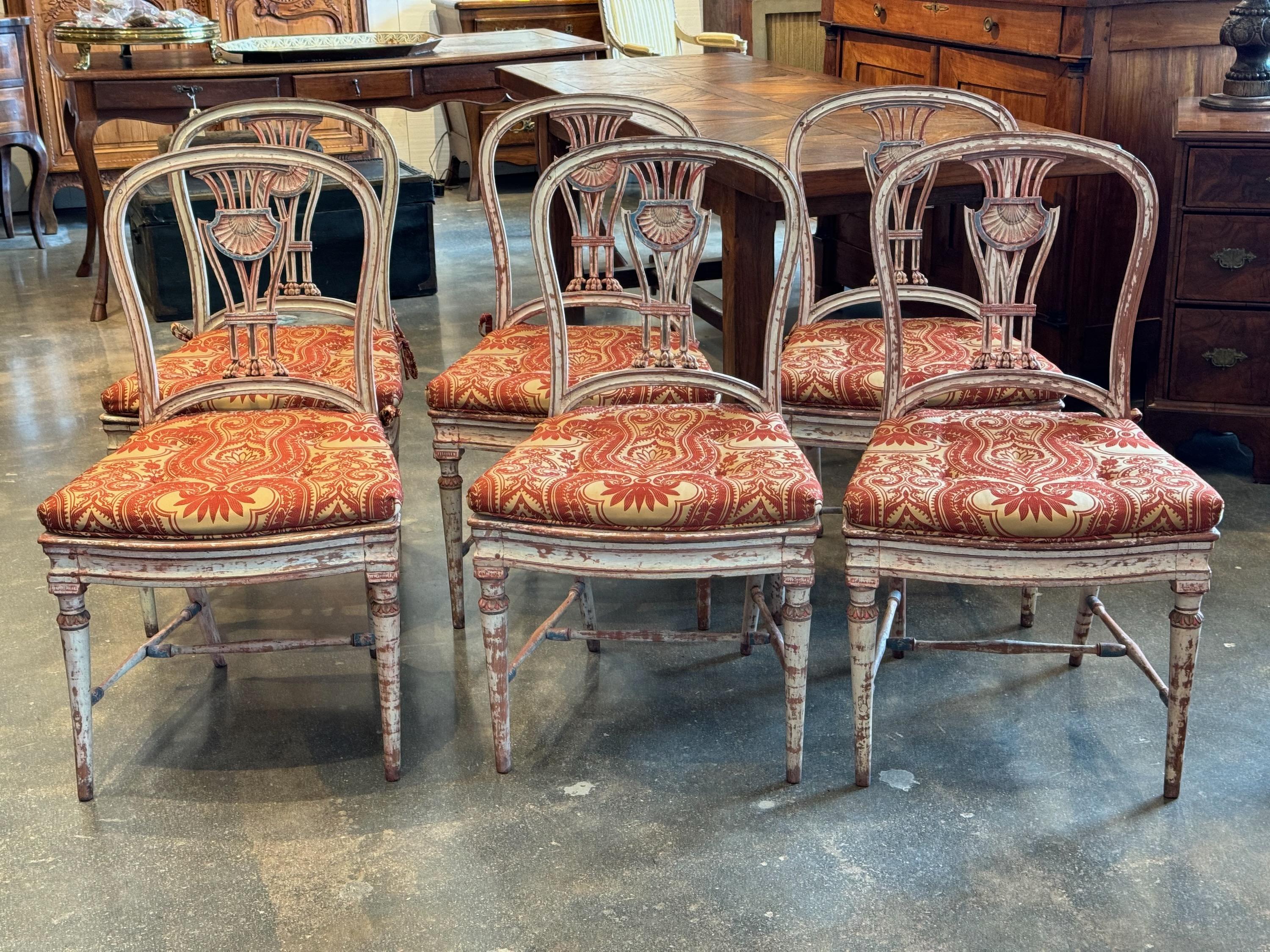 The prettiest chairs we have had in a long time. Beautiful paint decoration with caned seats and cushions .