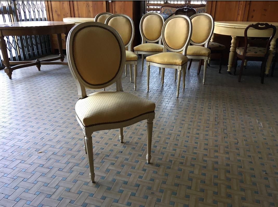 19th century set of six wood and fabric French dining chairs.