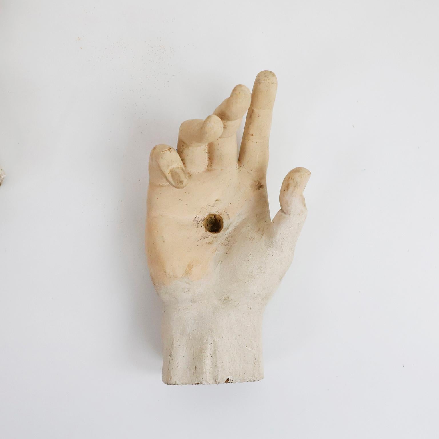 Circa 1900. We offer this fantastic set of study hands saint sculptures. This set of pieces belonged to a sculptor of religious figures who used these models to create the christian saints. One made in wood and the other in stucco.