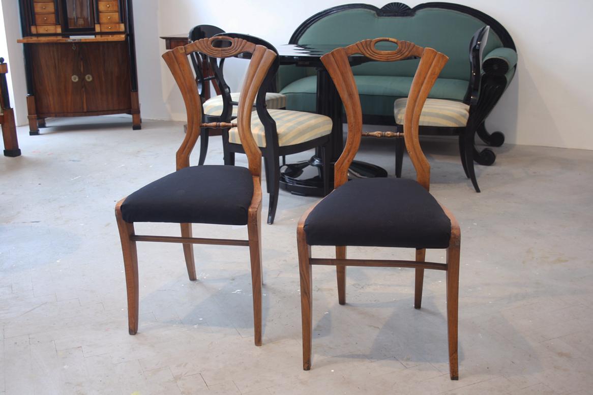 Hello,
This fine walnut Viennese Biedermeier chairs were made circa 1825-30.

Viennese Biedermeier is distinguished by their sophisticated proportions, rare and refined design and excellent craftsmanship and continue to have a great influence on