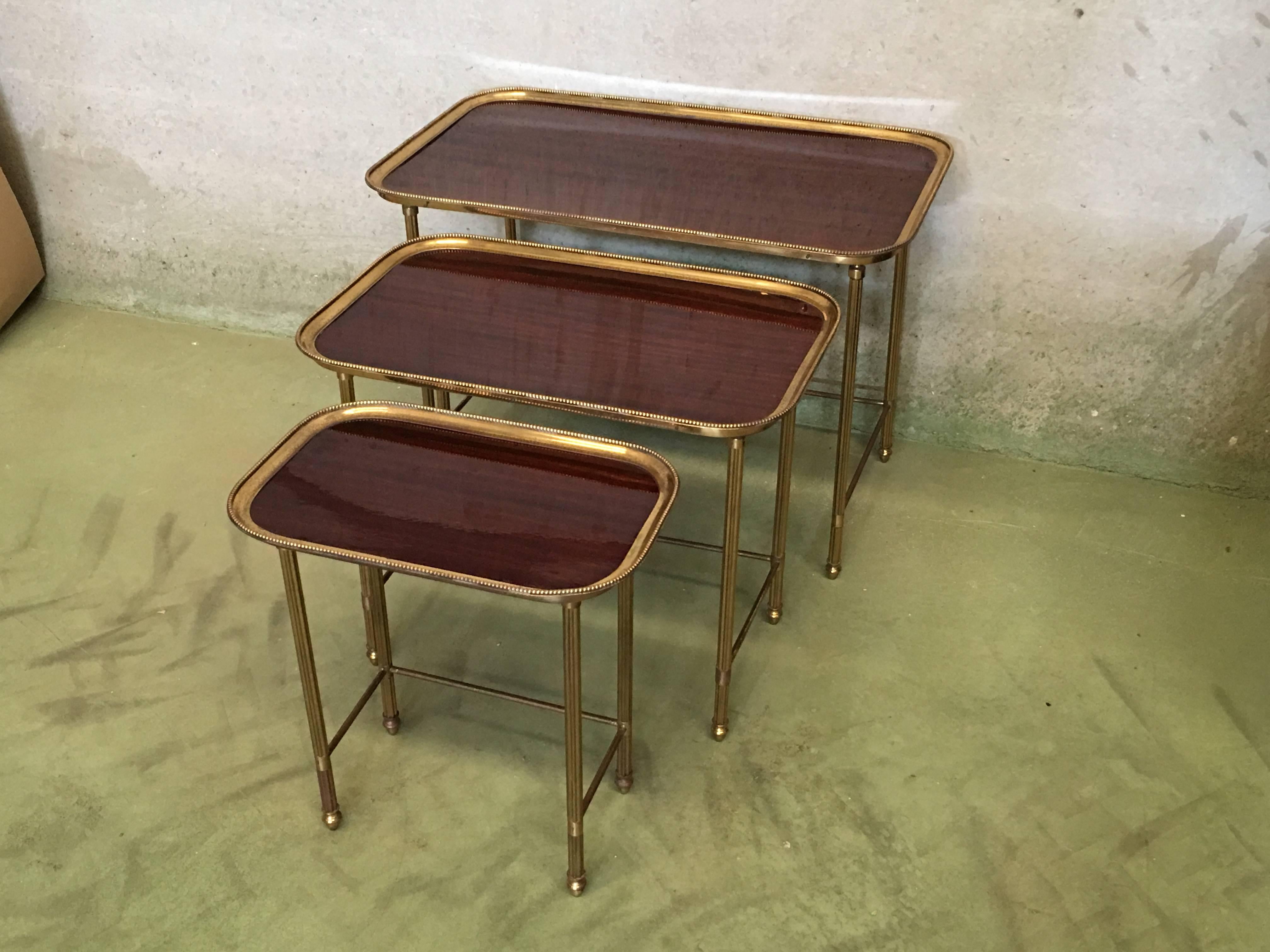 19th century set of three nesting tables in brass and mahogany, France

Dimensions: Width 28.34, depth 16.73, height 19.88
Dimensions: Width 22.57, depth 13.77, height 18.50
Dimensions: Width 16.53, depth 10.62, height 16.92.