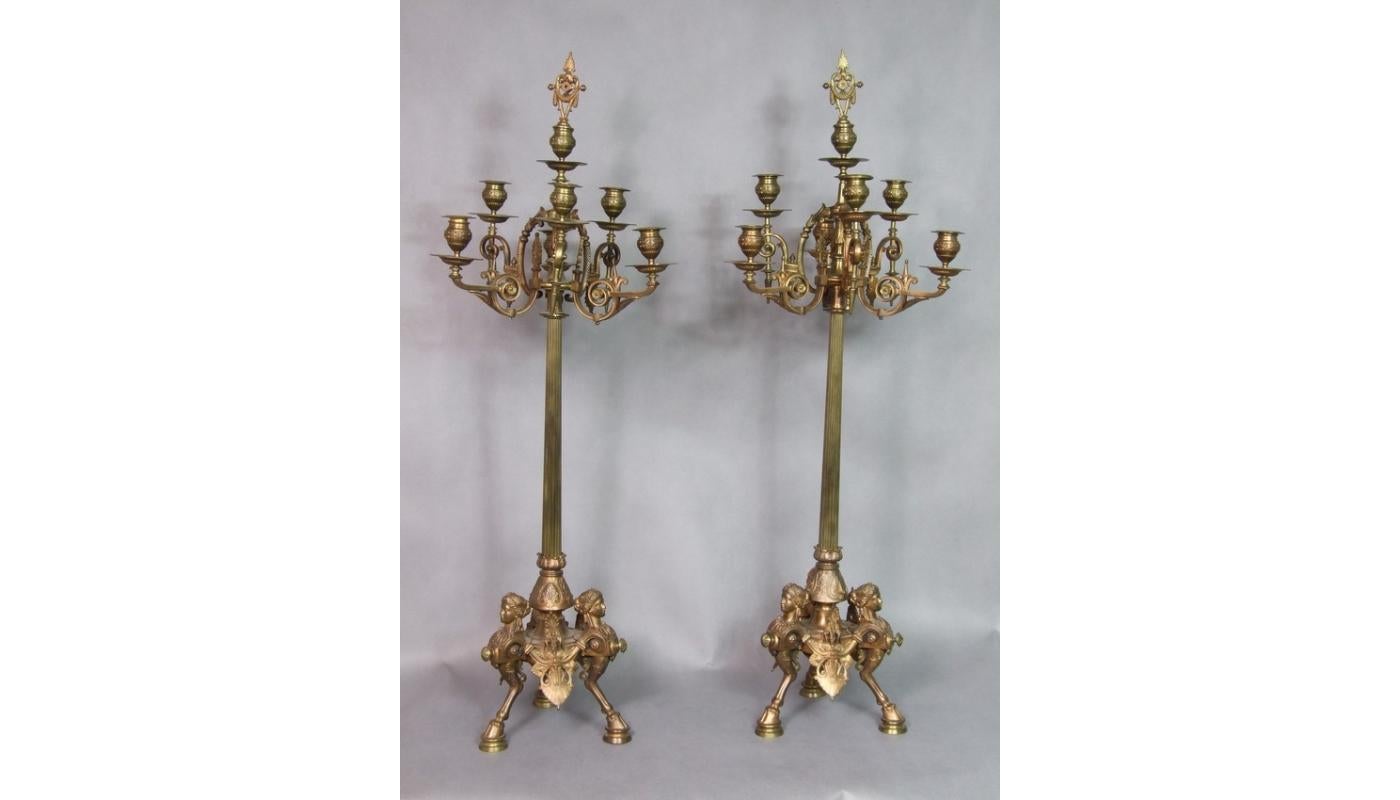 Set of two candelabras with six arms. The rich decoration draws attention, the legs of the candlestick take the form of horse hooves combined with a female, hermetic bust.

France, 19th century, bronze.
   