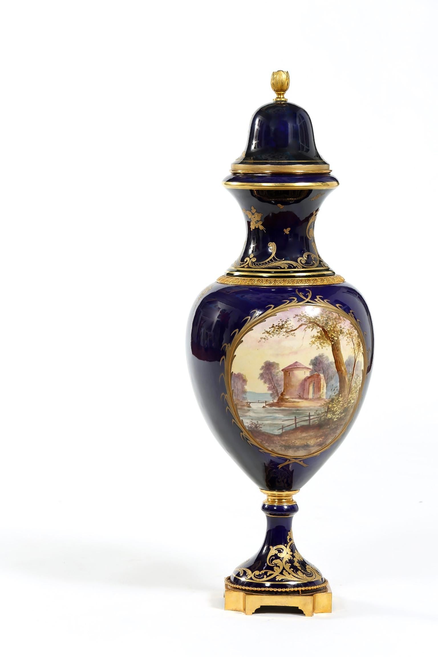 Large 19th century Sevres cobalt blue lidded decorative porcelain urn / centerpiece. The piece is in great antique condition with wear consistent with age / use. Maker's mark undersigned. The Urn stand about 29 inches high X 11 inches diameter 