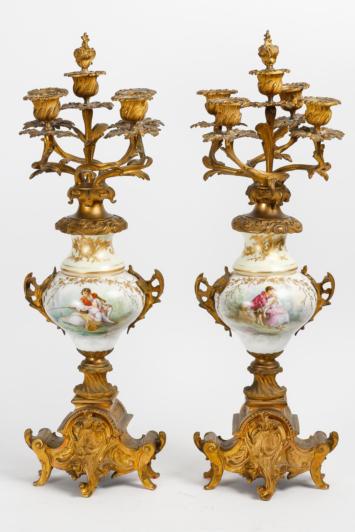 19th century Sèvres porcelain mantel set.

Original Sèvres porcelain and gilt bronze mantelpiece from the 19th century, consisting of a clock and its two candelabras. Allow for the clock movement to be restarted.
Clock: h: 54cm, w: 30cm, d: