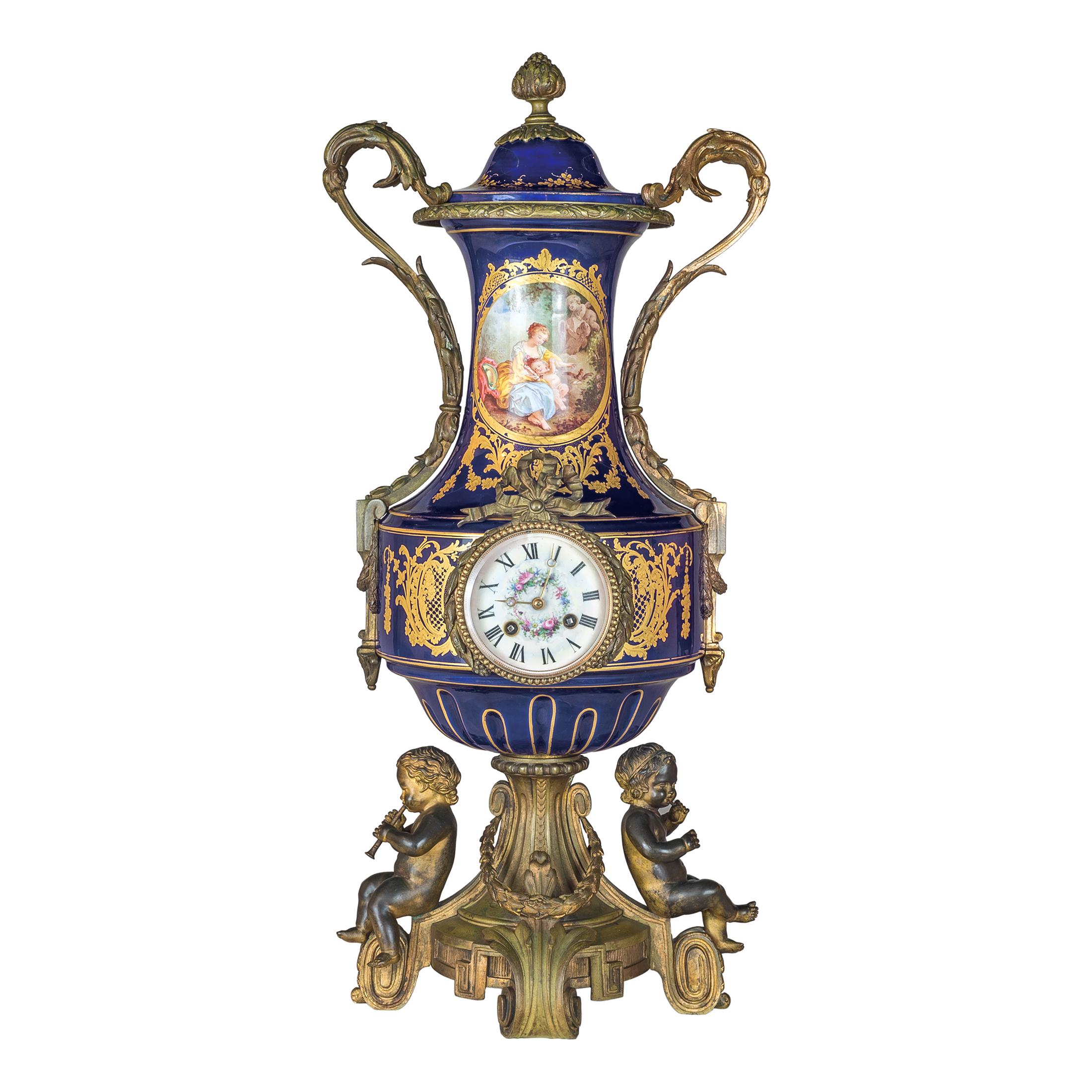 A fine quality 19th century Sèvres ormolu-mounted porcelain clockset.

Origin: French
Date: 19th century
Dimension: Clock: 25 in high; Urns: 24 in high.