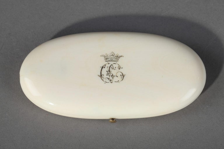 Late 19th century oval sewing box decorated with crowned monogram. The case contains five gold and steel sewing utensils embellished with small flowers. Labeled on the inside: AUCOC A PARIS. Weight: 27.6 g,

circa 1860
Dimension: W 4.5 in, D