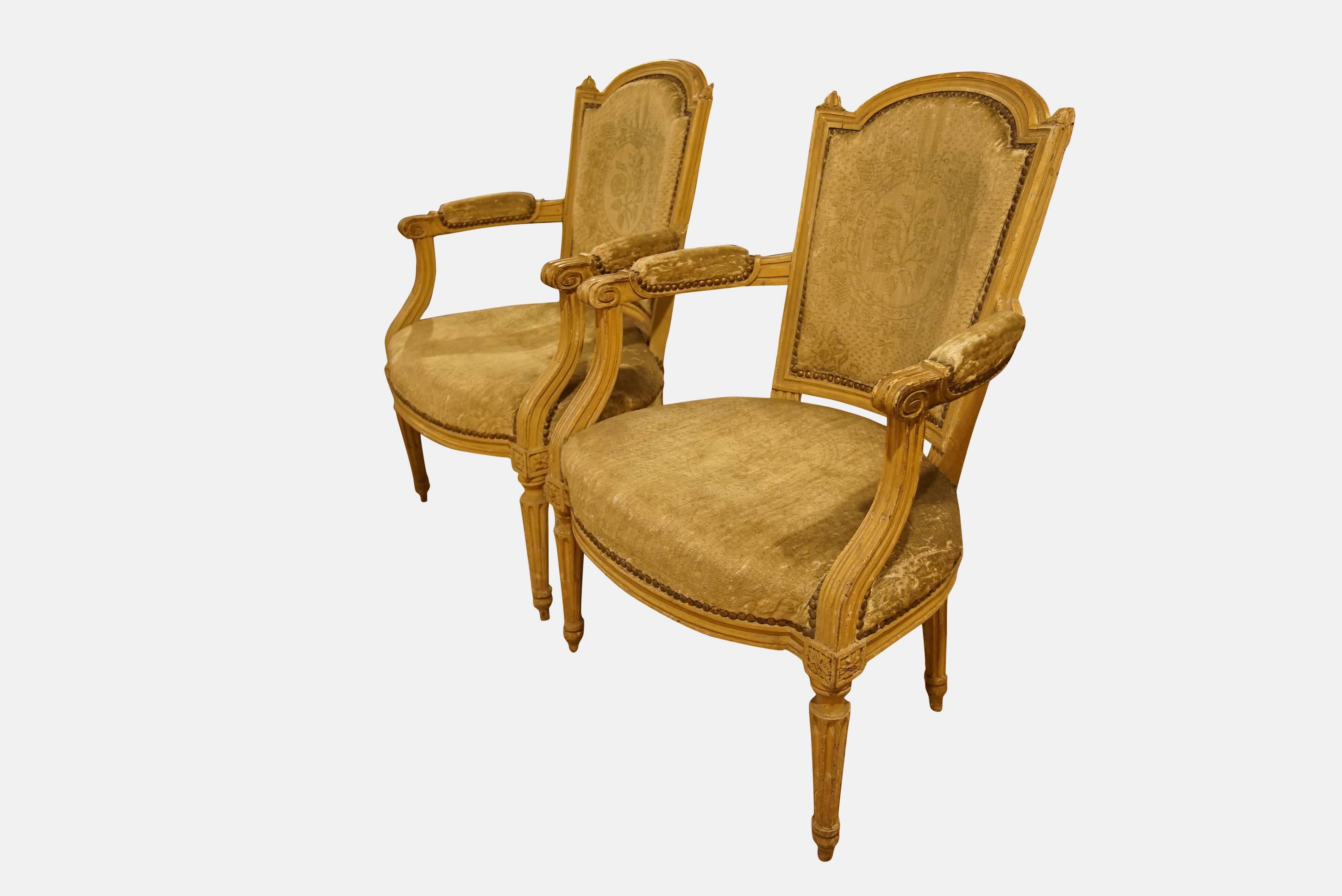 A pair of late 19th century Shabby Chic French Salon chairs with worn and faded upholstery commensurate with age.

Two pairs available.


