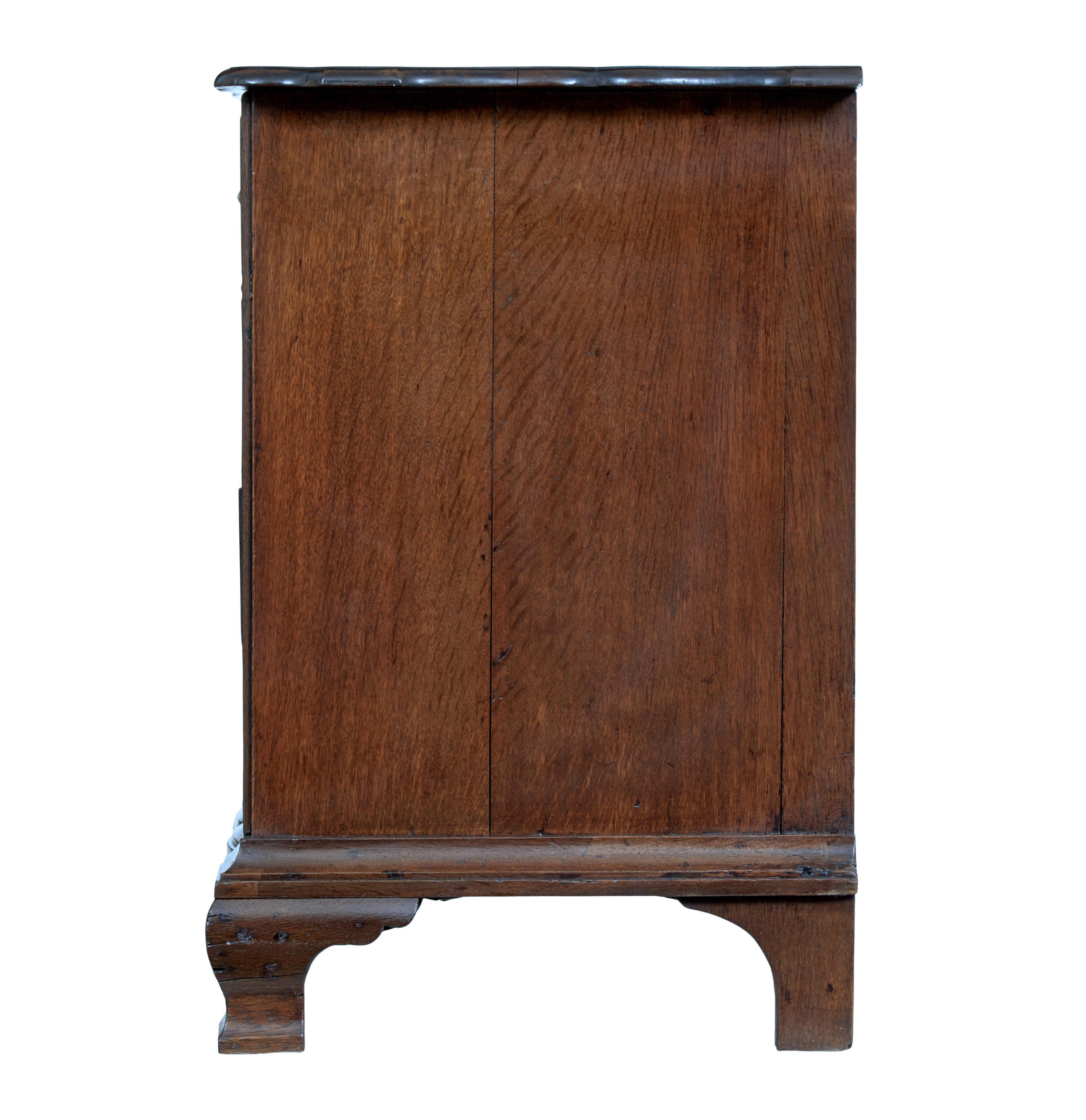 Baroque Revival 19th century shaped front oak chest of drawers For Sale