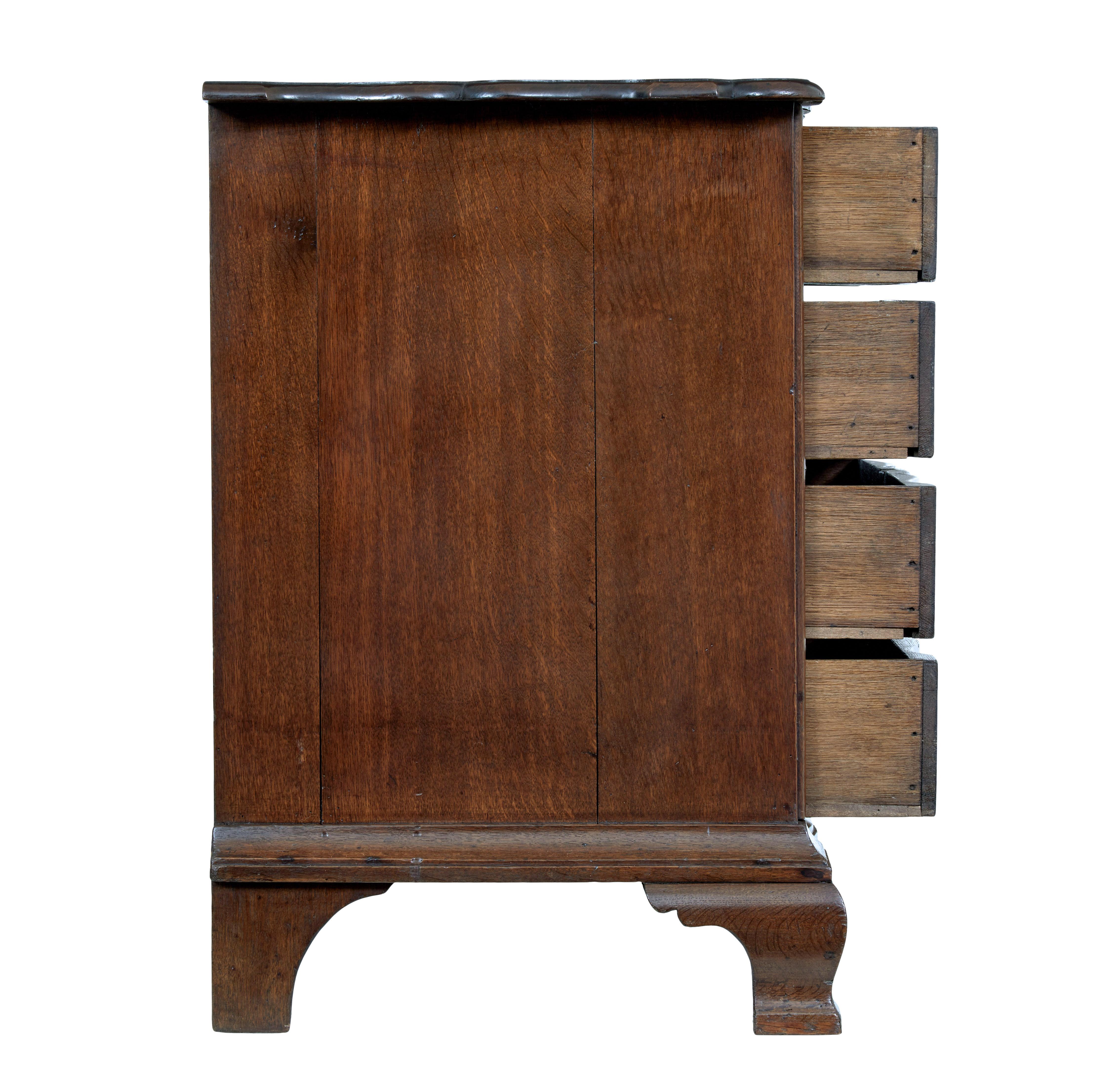 Hand-Carved 19th century shaped front oak chest of drawers For Sale