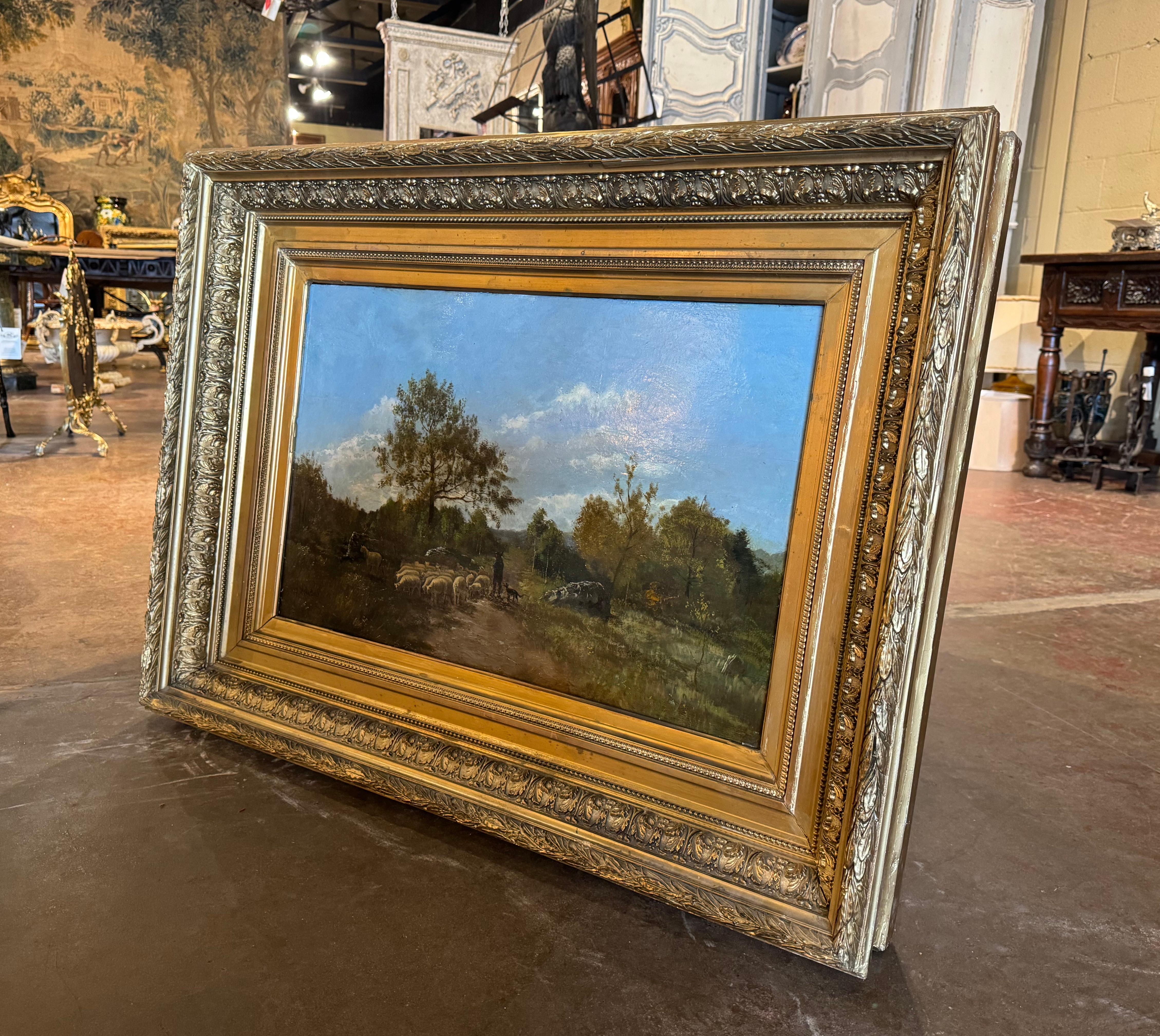 Decora un despacho o un estudio con este gran cuadro antiguo de ovejas. Pintada a mano sobre tabla en Bélgica hacia 1890, y colocada en el grueso marco original de madera dorada tallada a mano, la obra está firmada en la esquina inferior izquierda