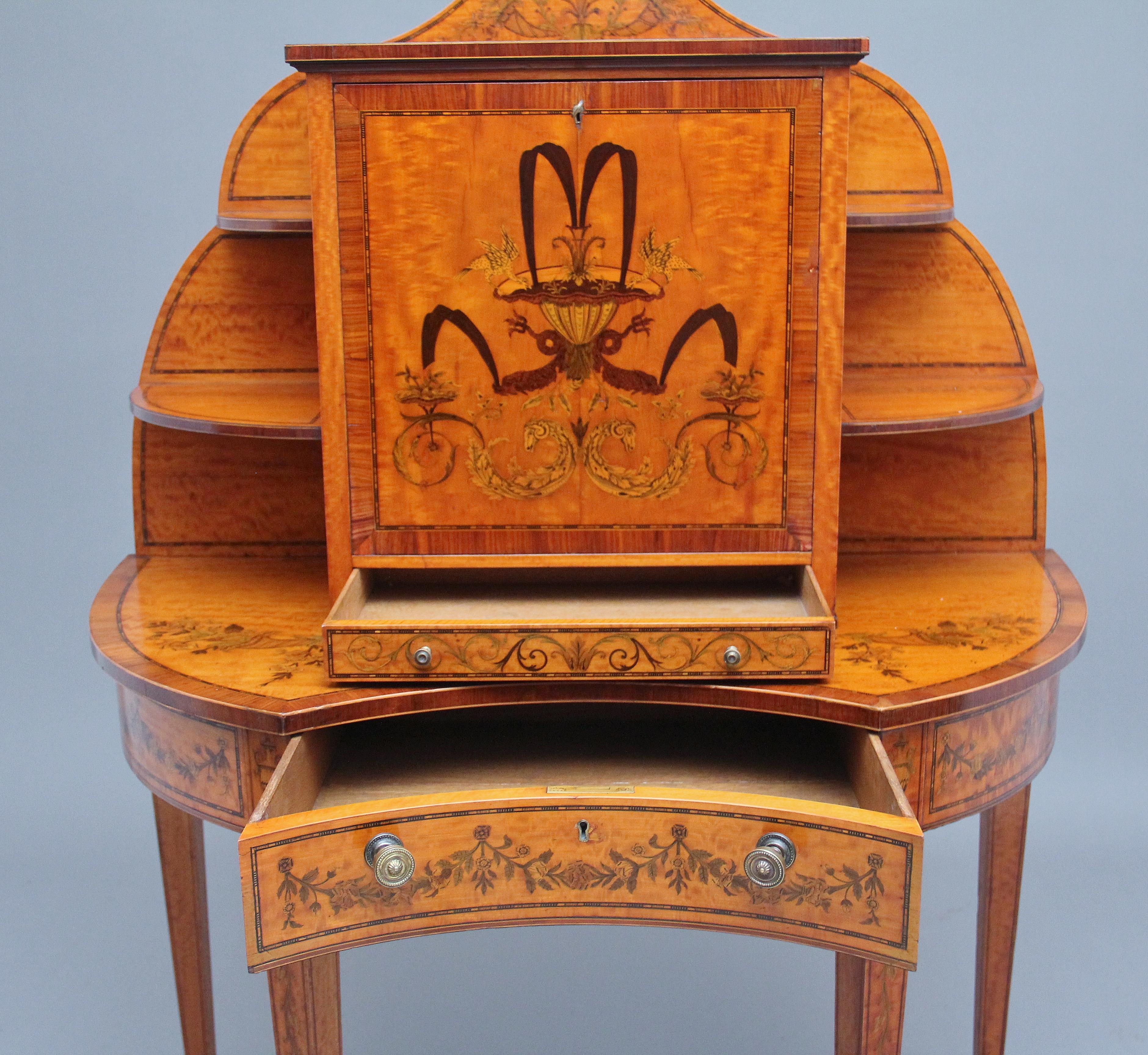 19th Century Sheraton revival satinwood and inlaid writing desk / cabinet attributed to Edwards & Roberts, the inlaid shaped frieze having chequer line inlaid quarter round shelves below flanking the fall profusely inlaid including a pair of birds