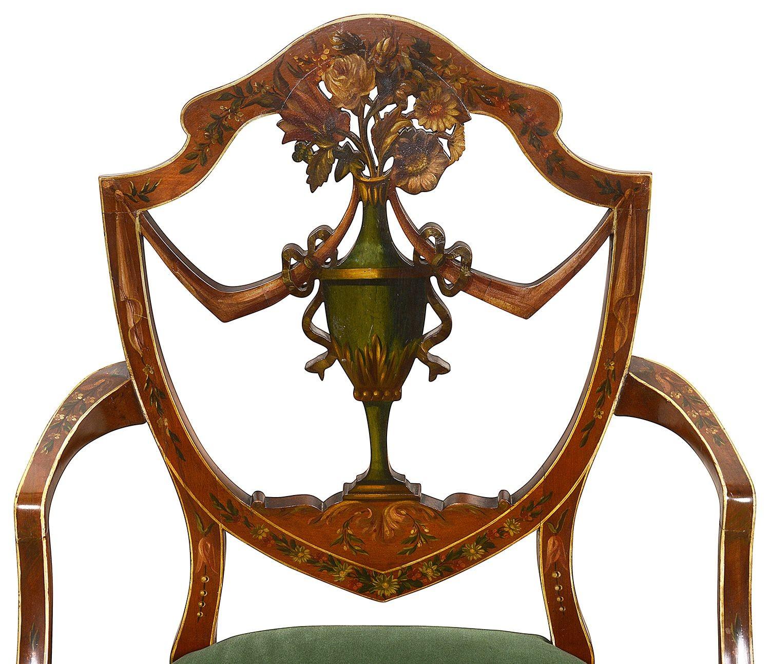 


A very good quality late 19th Century Sheraton revival shield back arm chair, with wonderful hand painted classical floral decoration, velvet upholstered stuff over seats and raised on elegant square taper legs.