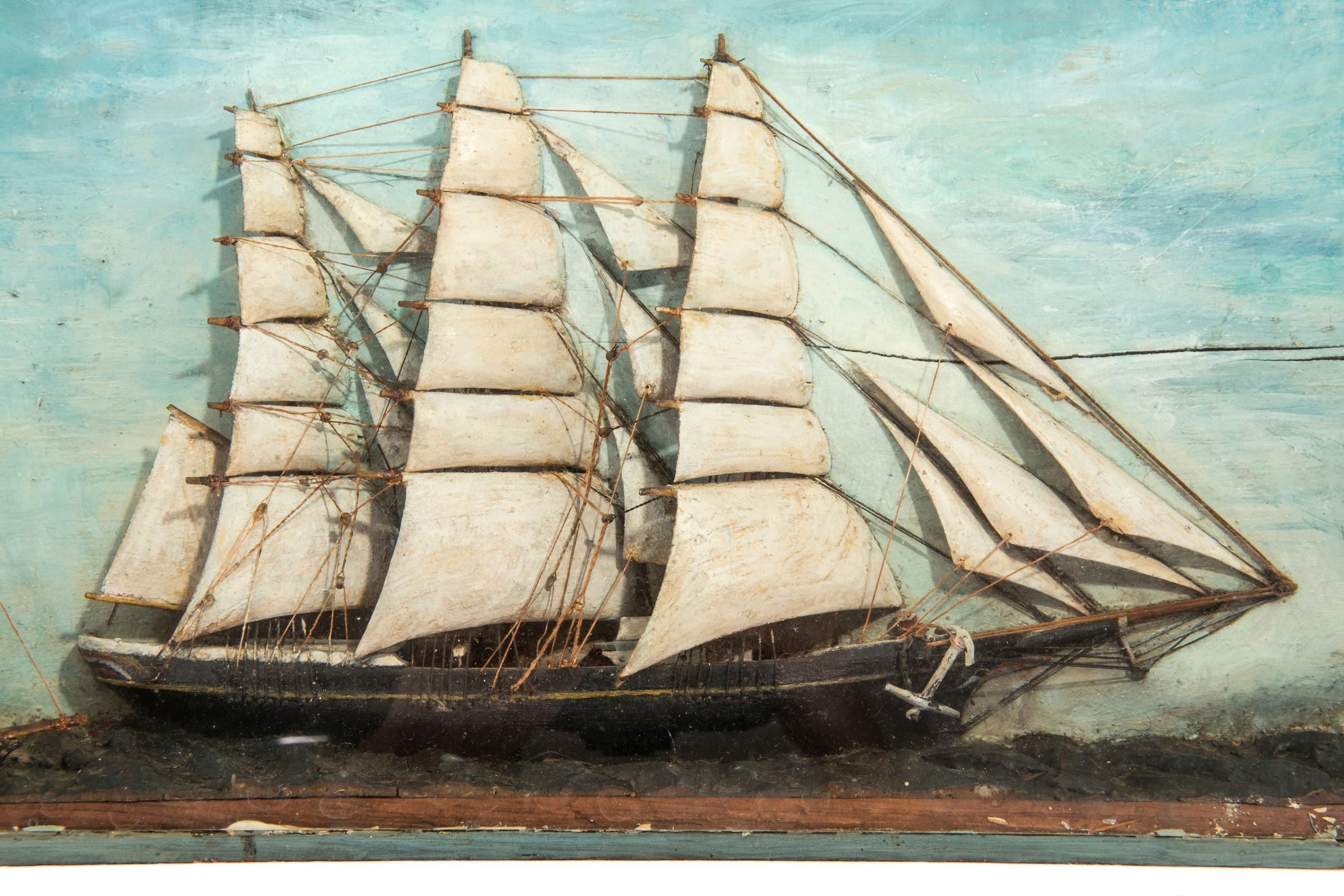 This beautiful handcrafted sailing ship in shadow box with smaller boat in tow shows rich
color and patina that only time can imbue. It has been in the family for over 60 years and
was 