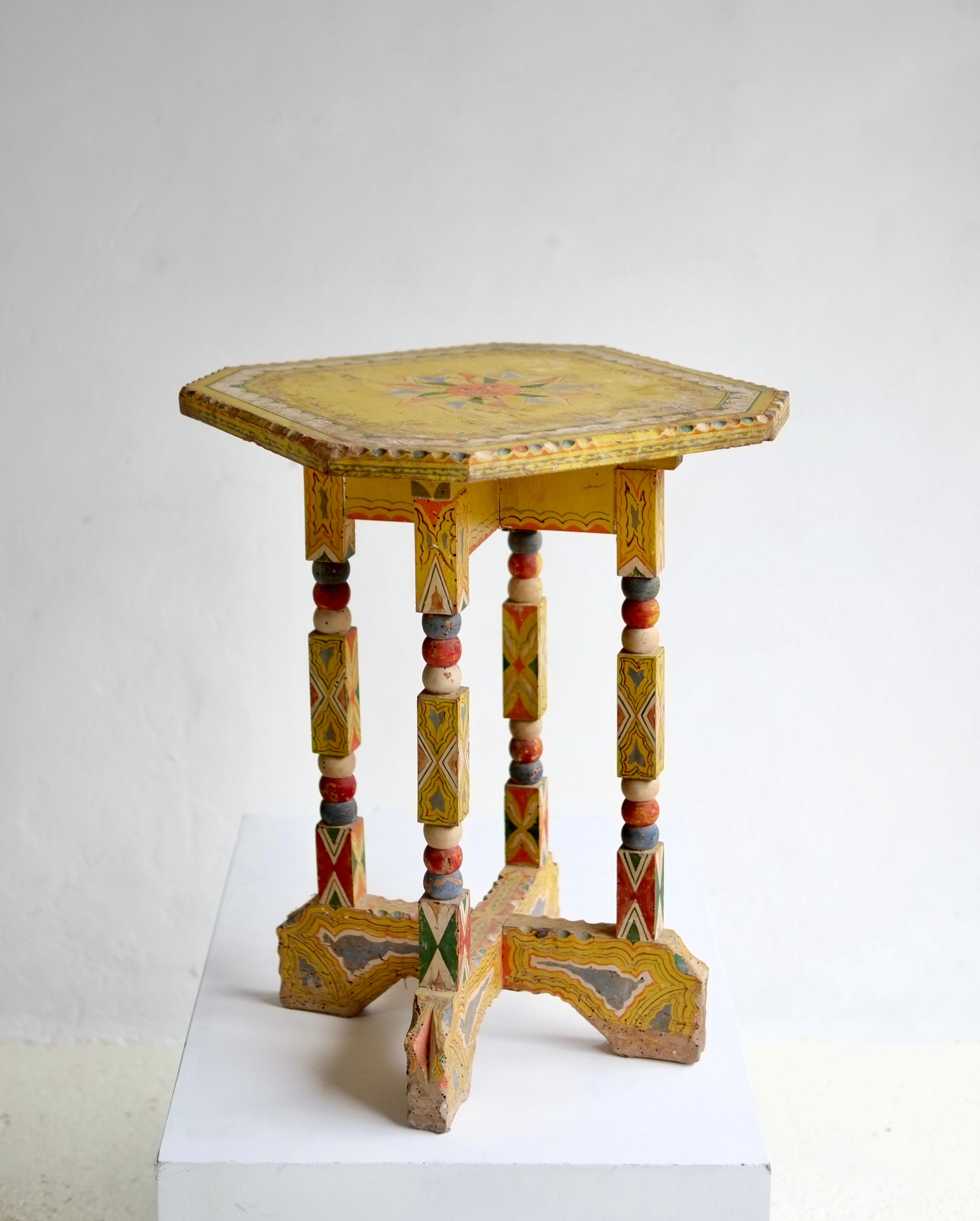 A 19th century hand painted Sicilian folk art side table. 

Featuring the vibrant folkloric motifs of traditional Sicilian artisans. This style influenced the work of Sicilian architect Ernesto Basile.

Paint loss and old wood worm holes.

H 61 W 44