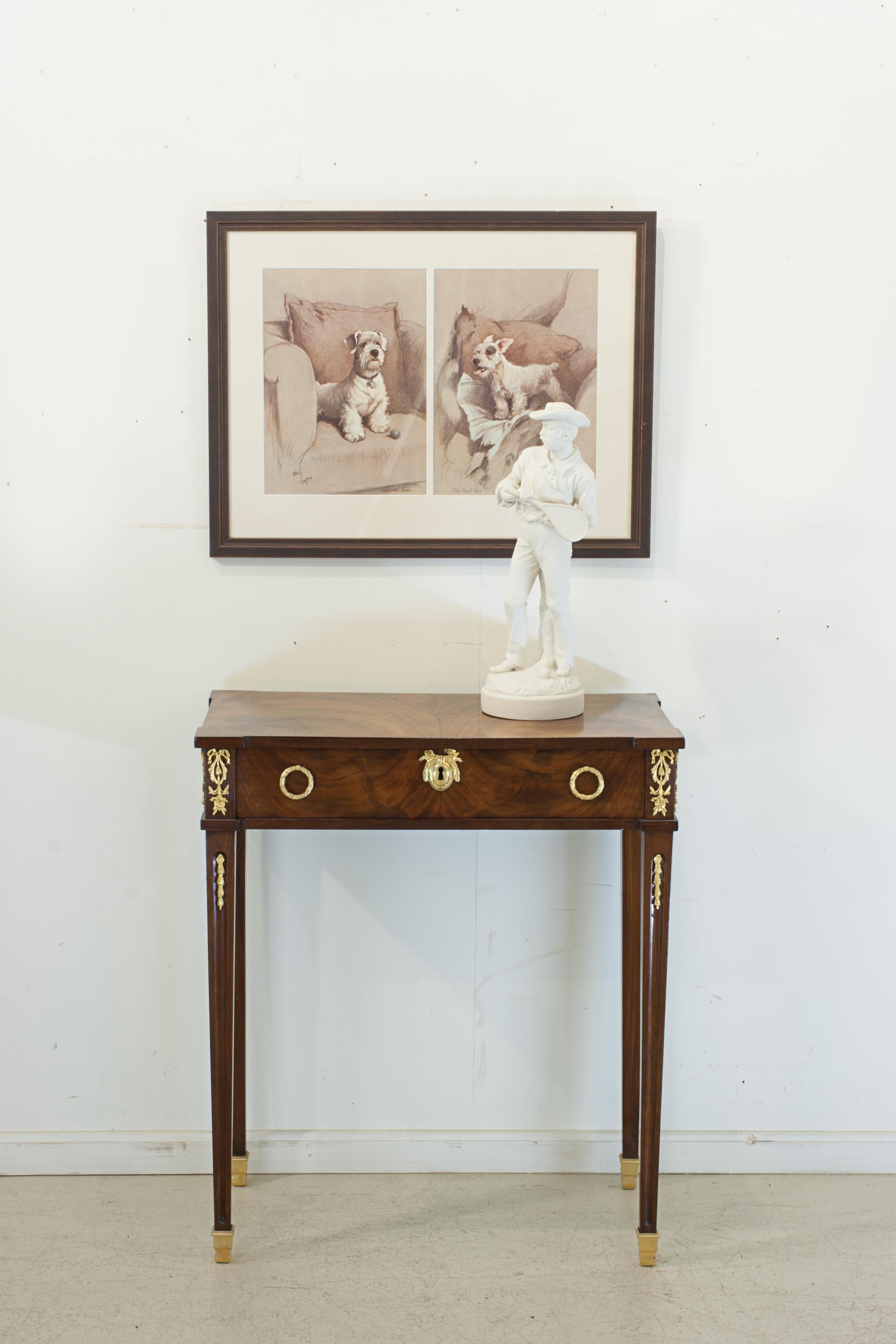Early 19th century, side table With gilt mounts and handles with single drawer.
A free standing Regency mahogany side table with single oak lined drawer with two gilt metal drop ring handles and decorative keyhole escutcheon plate. A well