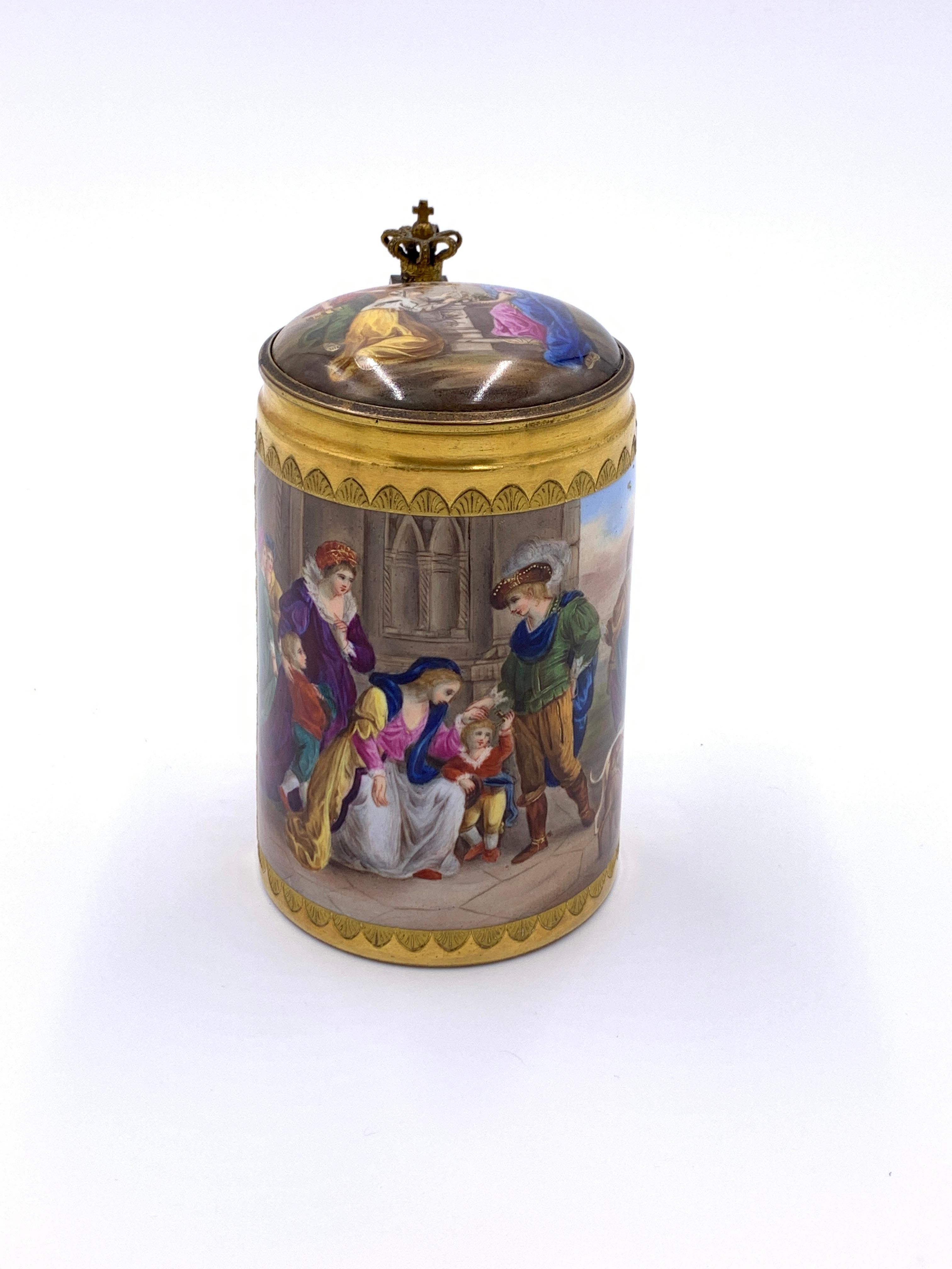 19th century Royal Vienna Porcelain lidded tankard, gilt metal in the shape of a crown above the handle and attached to the lid, depicting group of people chatting, blue beehive mark stamped on the base and the signature of the artist in the front