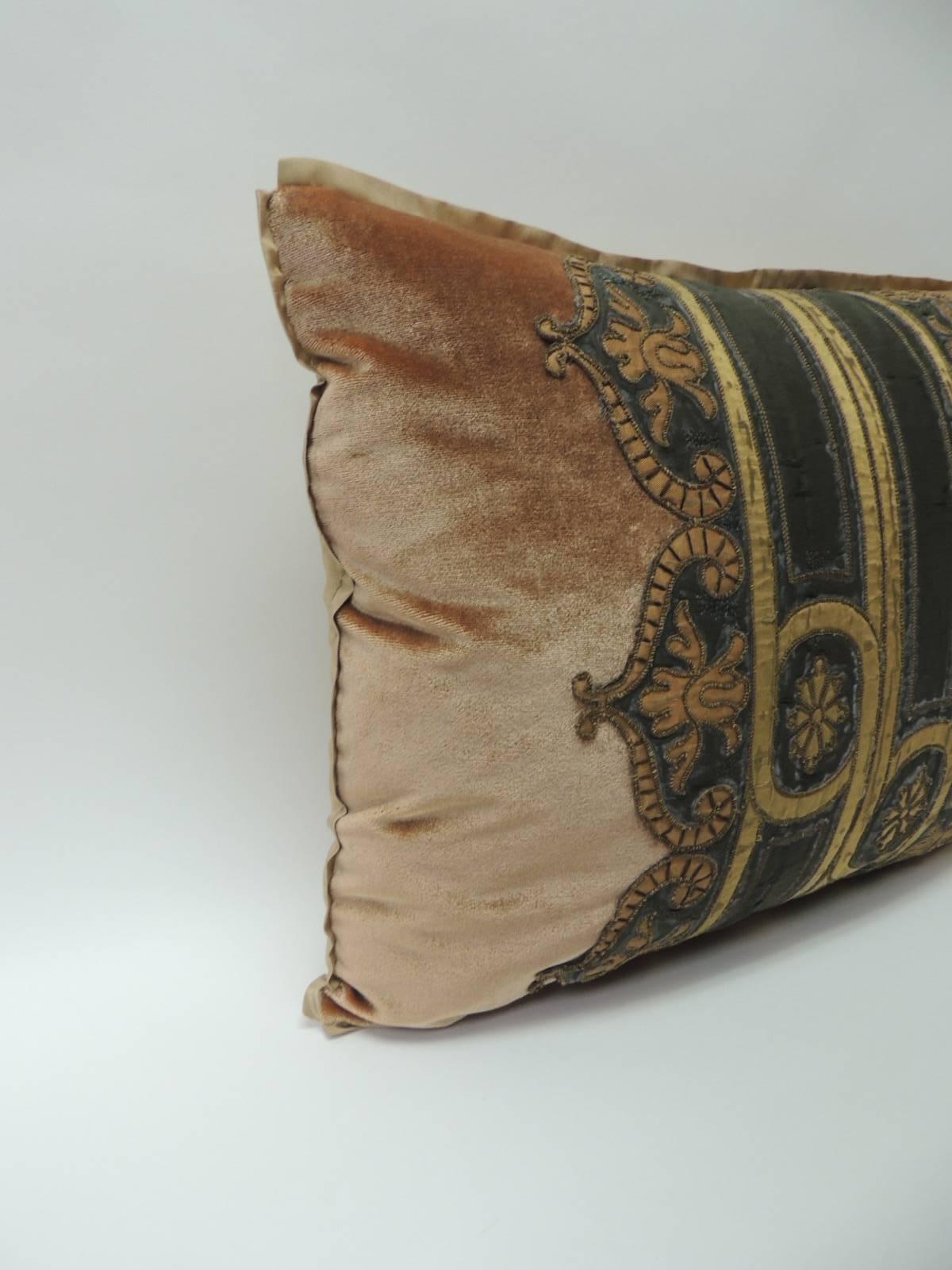 19th century silk golden velvet with French silk woven velvet ribbon decorative pillow
Bolster throw pillow handcrafted with golden silk velvet framed with a French green and gold woven embroidered deco inspired trim. Art Deco style trim exhibits a