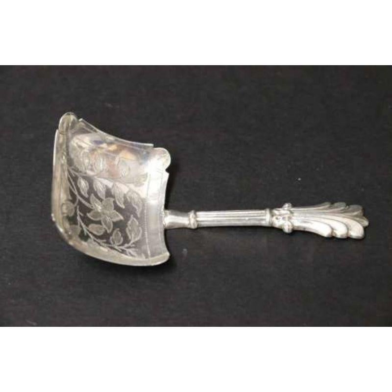 An antique early Victorian silver caddy spoon with a rectangular bowl with Foliate Engraving.

This superb rare early Victorian silver caddy spoon had an ornate embossed handle and a rectangular bowl with re-entrant corners. The bowl is finely