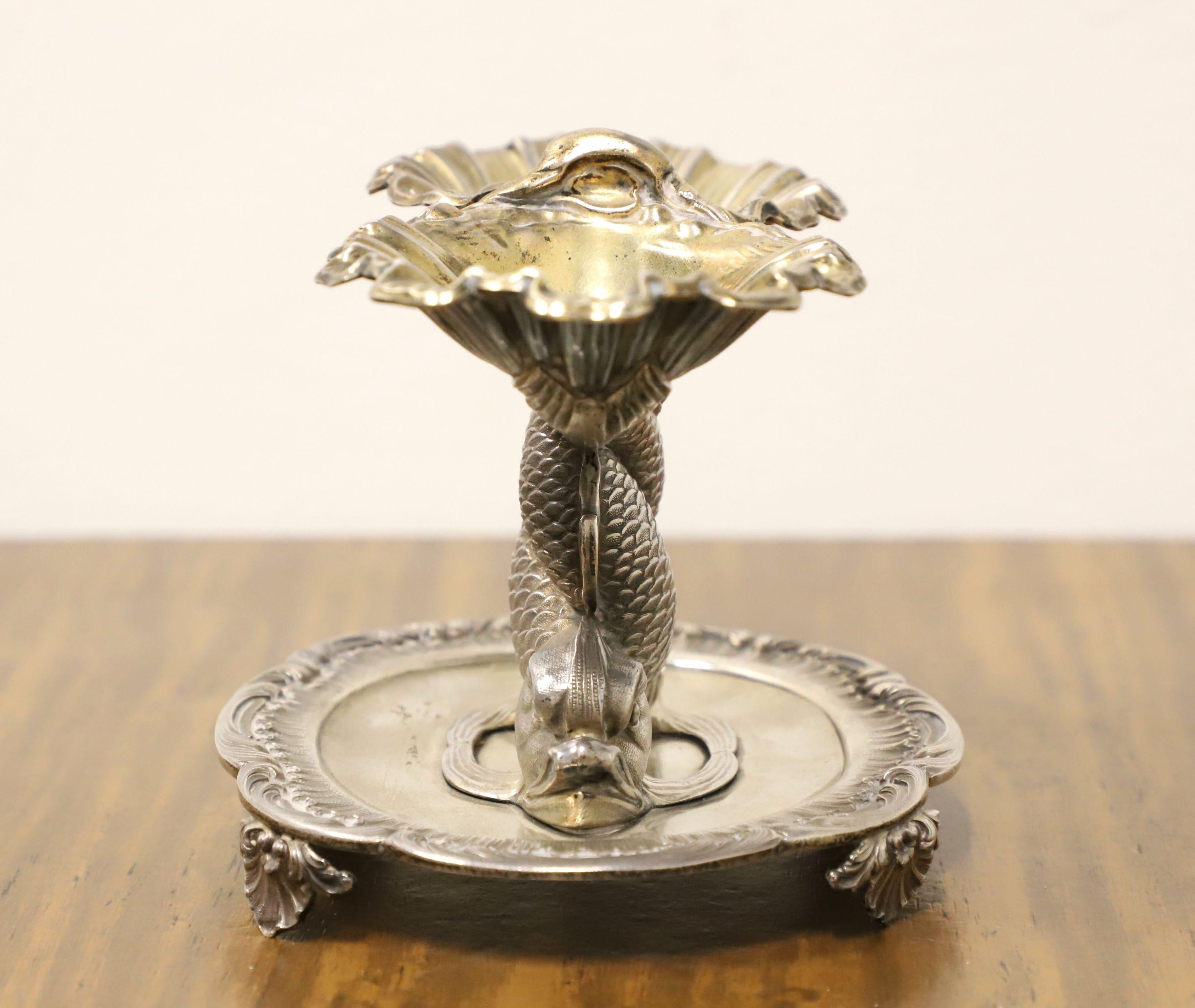 A French Louis XV style silver double salt cellar by the Parisian silversmith Jean-Baptiste-Claude Odiot. Crafted to the French silver standard, shaped like intertwined dolphins with their tails holding up two oyster shells and their heads resting