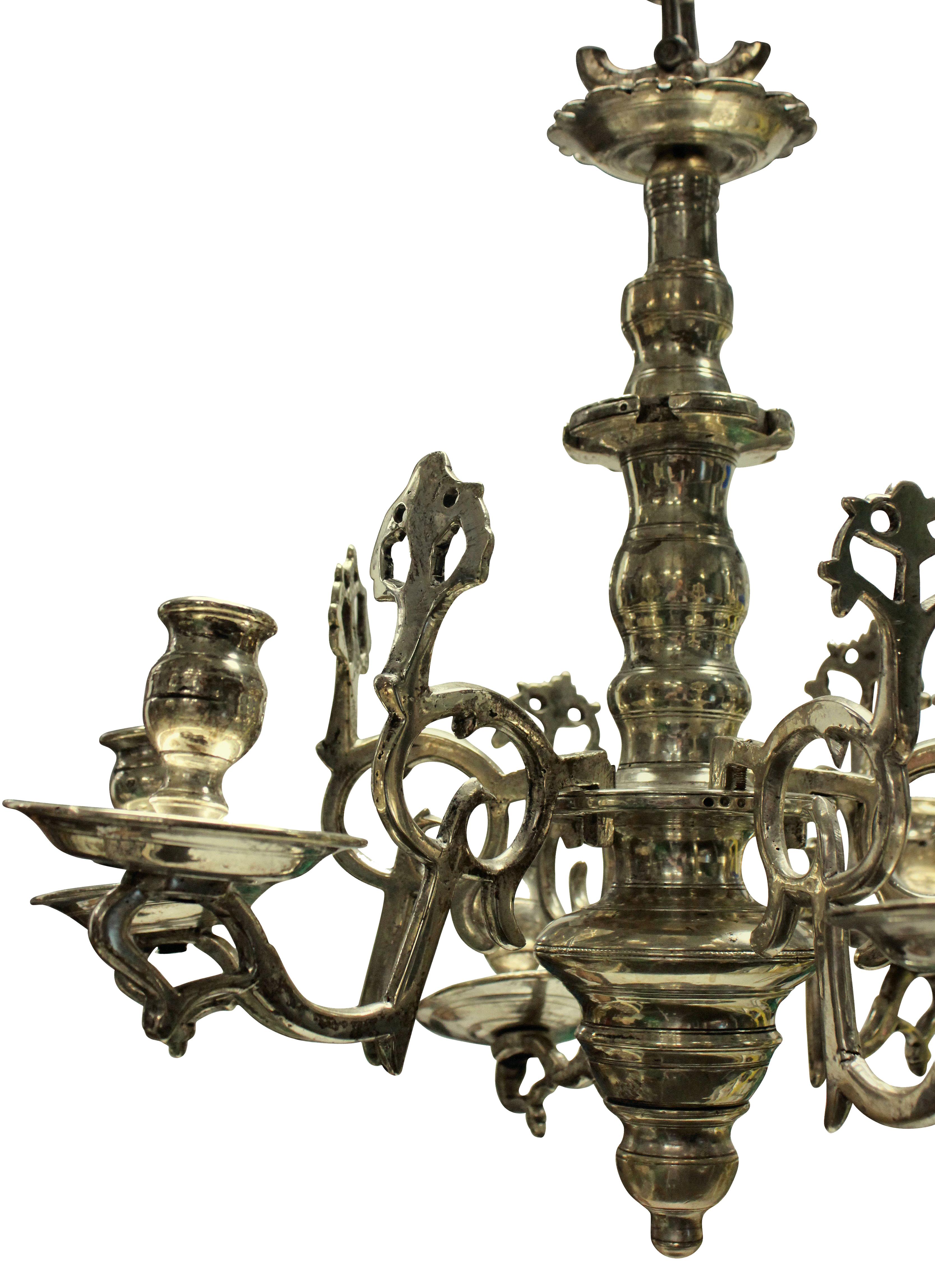 A small Flemish chandelier in silver plated bronze, for candles.

 