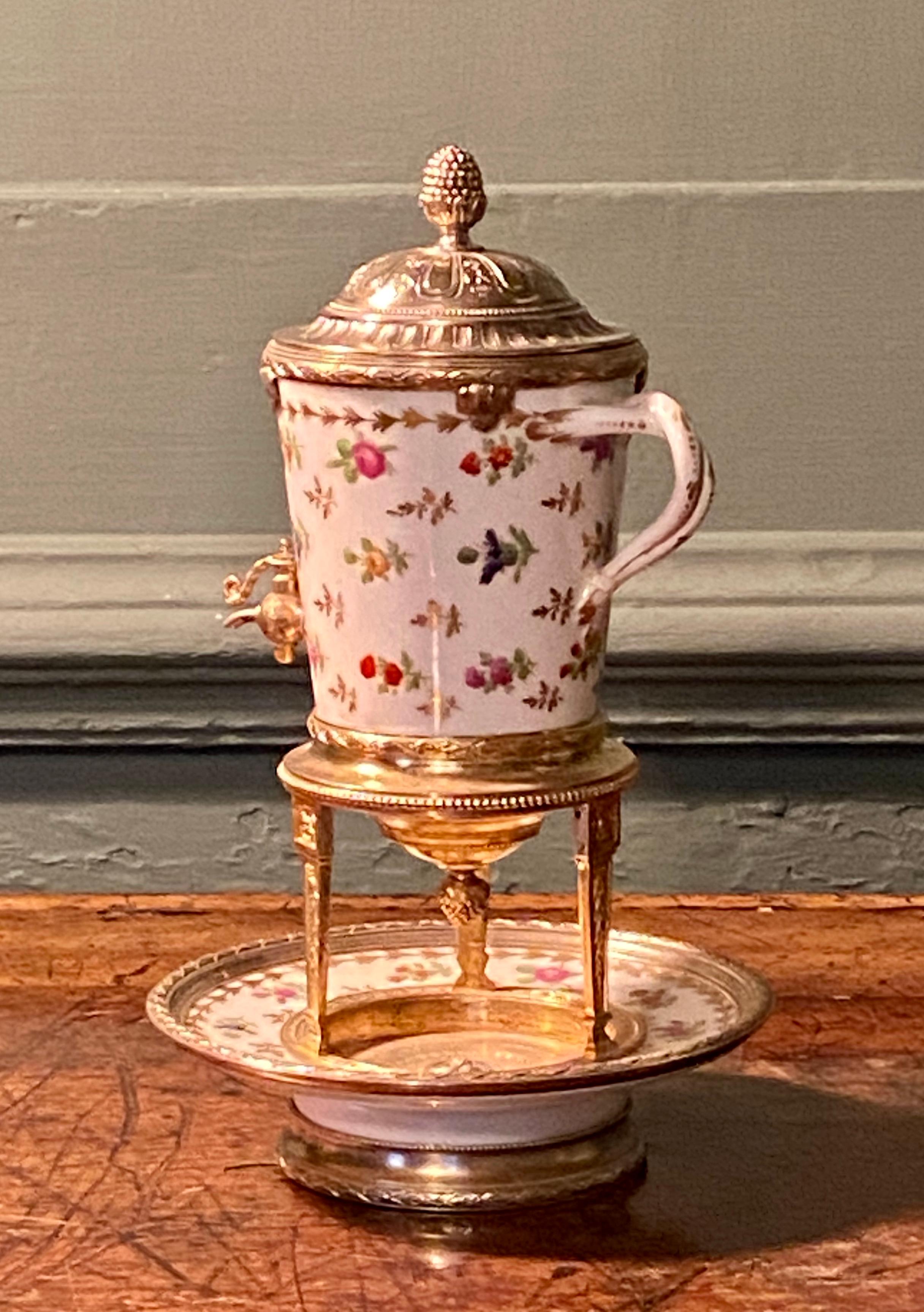 French Louis XVI style silver-gilt mounted porcelain liqueur dispenser.